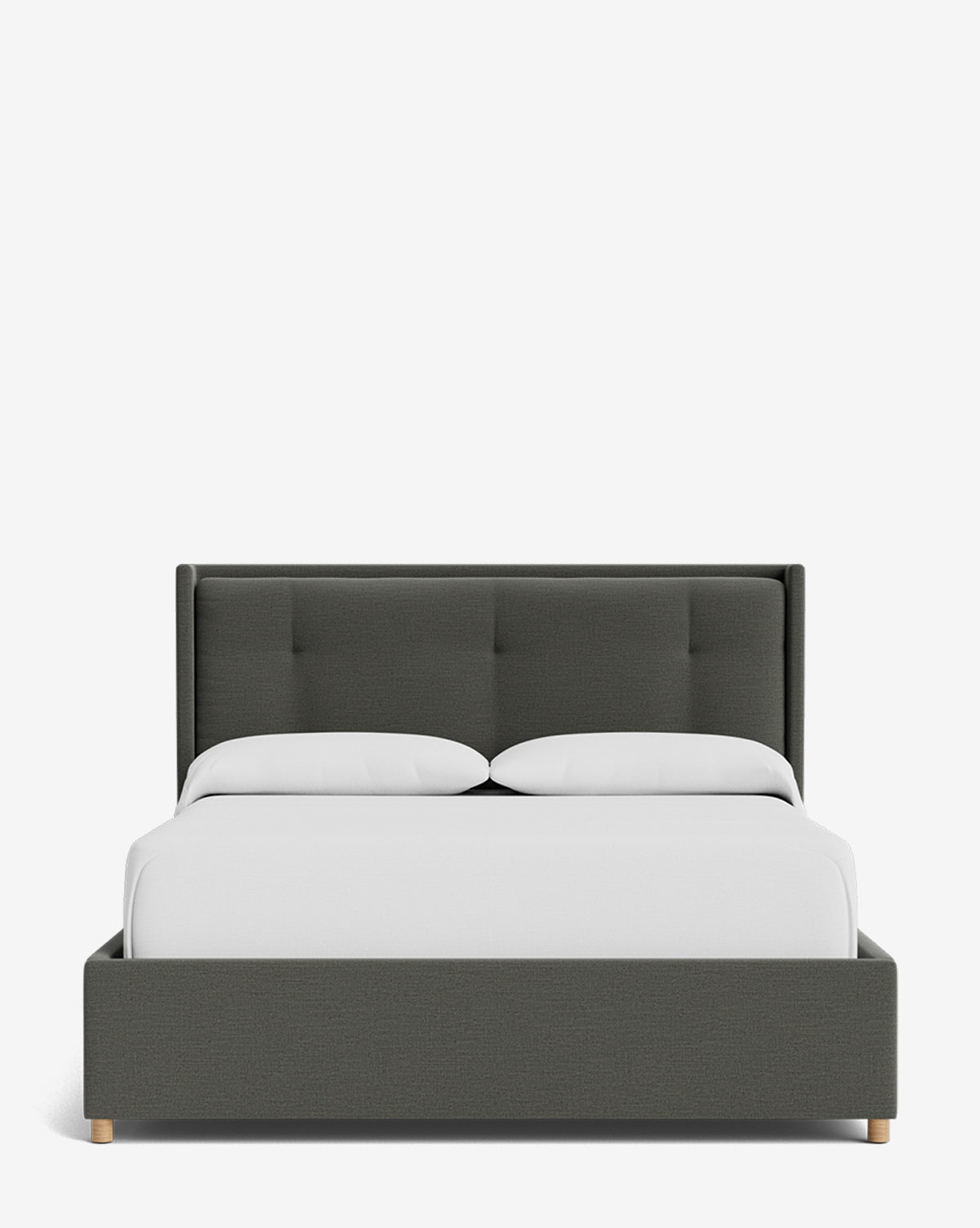 The Ria Bed Low Headboard showcases a modern design with dark gray upholstery, a tufted headboard, light wood legs, crisp white bedding, and two white pillows by Vendixs