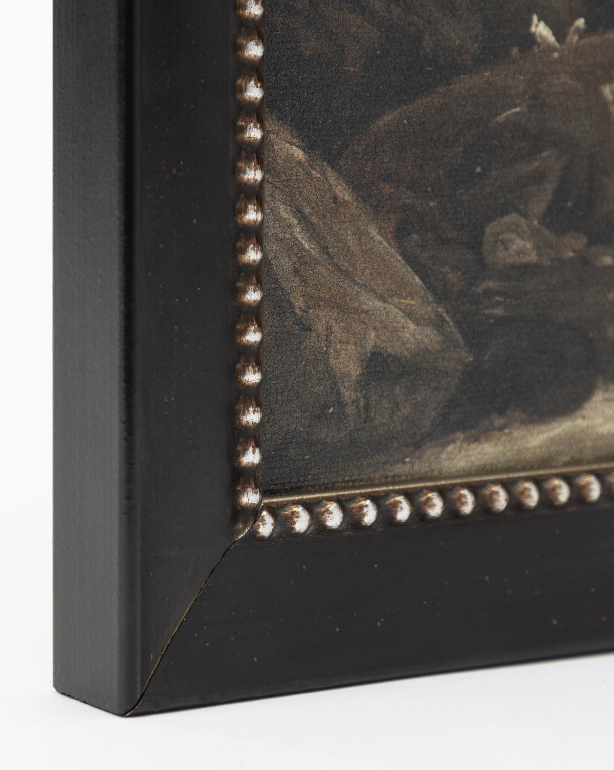 Close-up of the bottom left of Rough Sea Shores, a gallery-quality framed painting. It features a dark wooden frame with a beaded edge and mitered joint; the artwork inside shows muted, dark tones evoking a windswept shoreline, by Vendixs