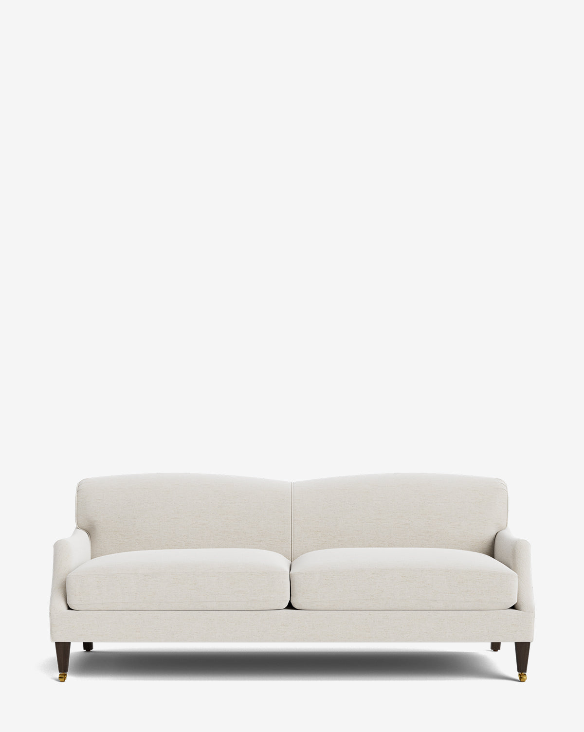 The Rowley Sofa 85 is a modern, light beige upholstered hand-crafted sofa with two seat cushions, wooden legs, and brass caster wheels on the front legs, shown against a plain white background by Vendixs