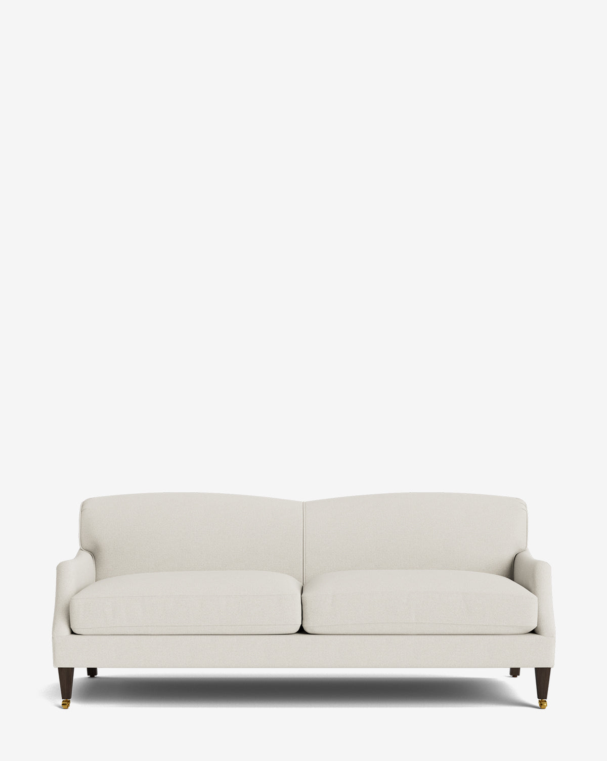 The Rowley Sofa 85 by Rowe Fine Furniture, Inc. is a modern, light beige hand-crafted sofa with two seat cushions, a low backrest, flared armrests, and dark wooden legs with brass casters. Customizable fabric options. Shown on a plain white background. Vendixs