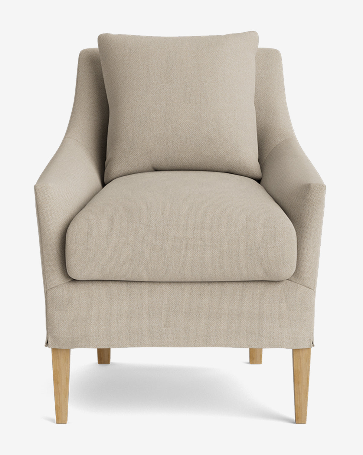 The Sascha Slipcover Dining Chair, shown against a plain white background, features a beige slipcover, wooden legs, a large back cushion, and a plush seat cushion, by McGee & Co.