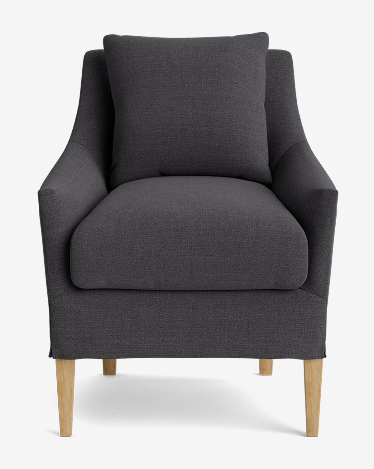 The Sascha Slipcover Dining Chair features dark gray upholstery, a matching cushion, curved armrests, and light wooden legs, by McGee & Co. Handcrafted and modern, it’s displayed here against a plain white background, by McGee & Co.