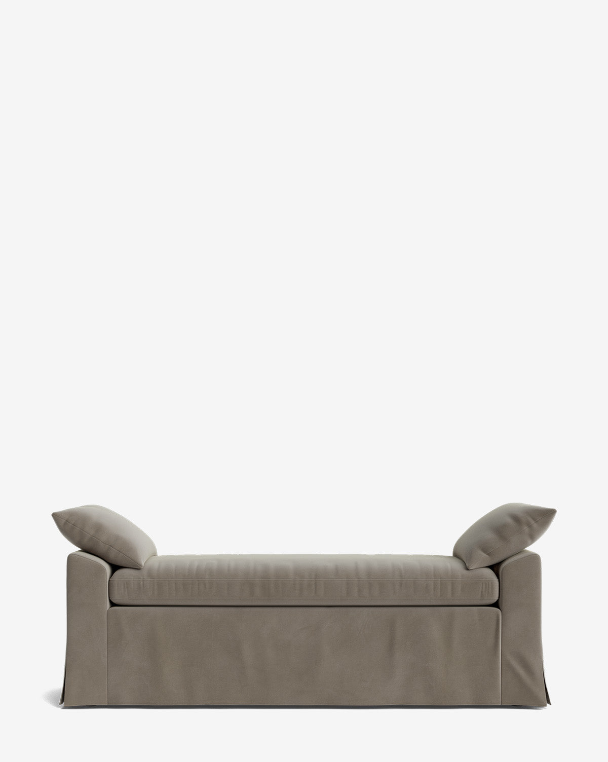 The Scaletta Bench is a modern, taupe-upholstered bench with two angled pillows at each end, a minimalist design, and a floor-length fabric skirt. Crafted in performance fabric, it’s shown against a plain white background by Vendixs