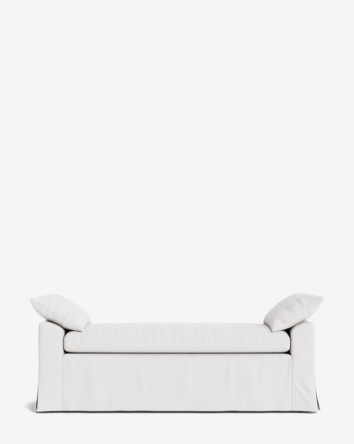 The Scaletta Bench is a minimalist white bench with two matching cushions at each end, set against a plain white background. Its modern, skirted design is crafted with performance fabrics for lasting durability, by Vendixs