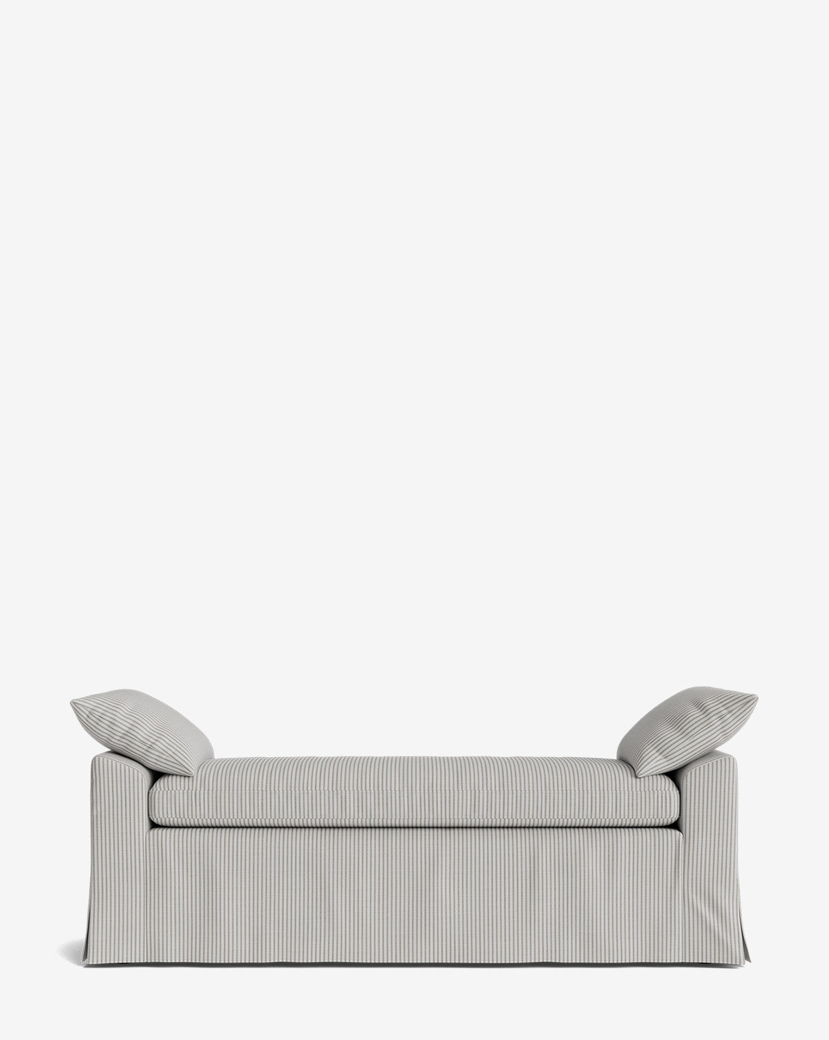 The Scaletta Bench is upholstered in performance fabric with stripes, two matching pillows, and a skirted base. Its clean lines and modern look are highlighted against a plain white background for a crisp appearance by Vendixs