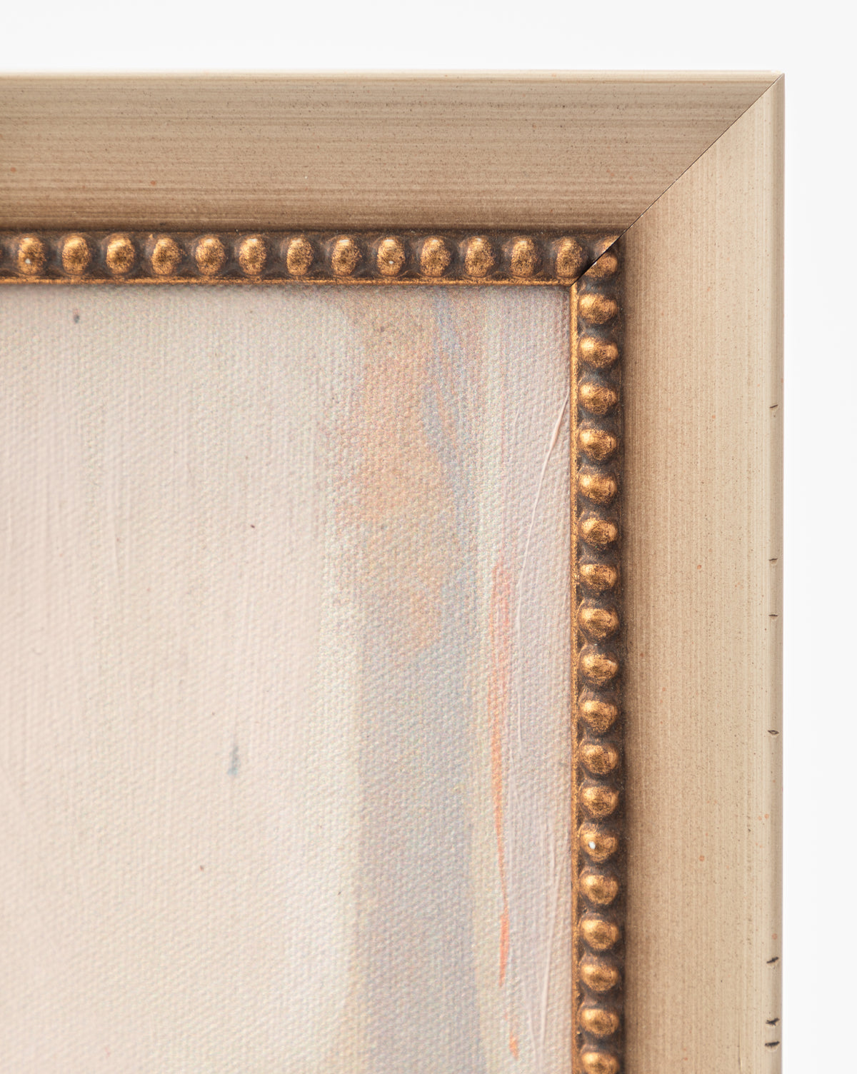Close-up of the top right corner of Single Blossom. The light gold frame features a decorative beaded inner edge, complementing the canvas’s soft neutral tones and evoking the gentle elegance of this romantic artwork, by Vendixs