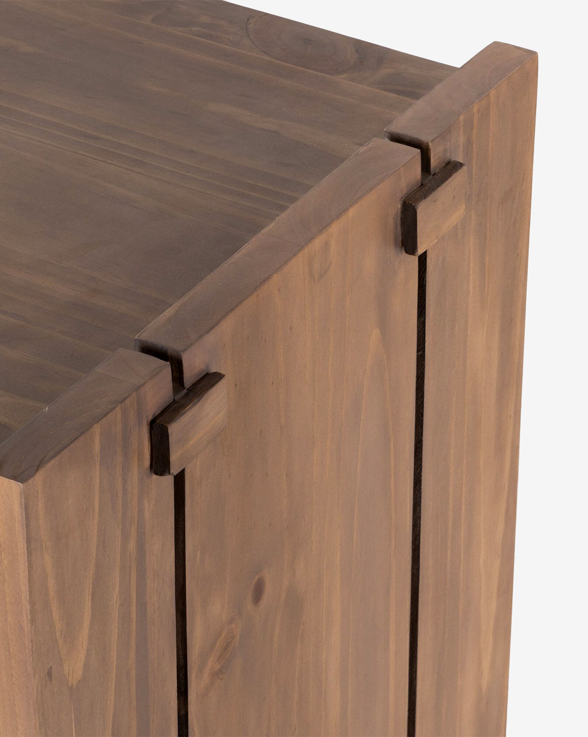 Close-up of the Sloane Sideboard corner, highlighting interlocking joints and a smooth, natural solid pine wood grain finish, by Vendixs