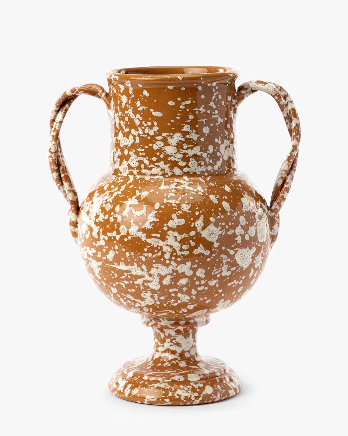 The Splatter Verona Vase is a handmade brown terracotta vase with two side handles, a rounded body, and white splatter patterns on a pedestal base, by Vendixs