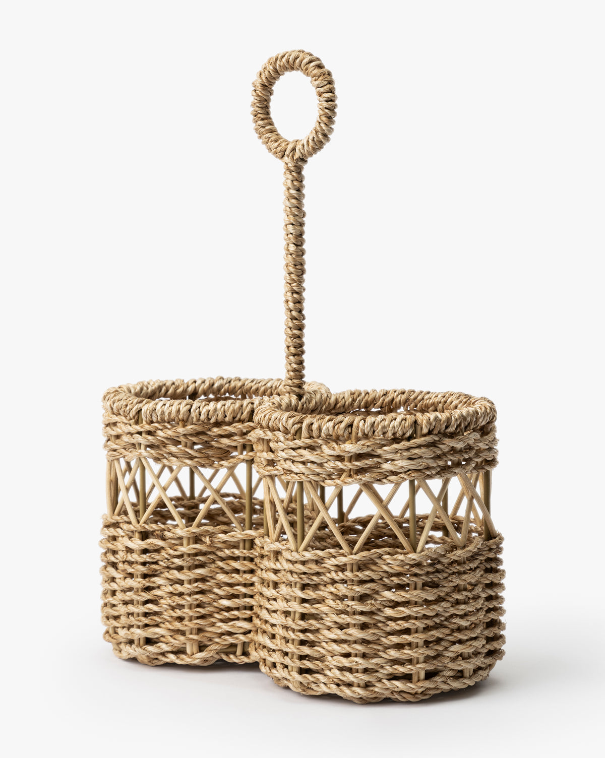 The Stokes Woven Caddy features two round abaca wicker compartments and a tall central handle with a circular loop, ideal for organizing your kitchen counter, by Vendixs