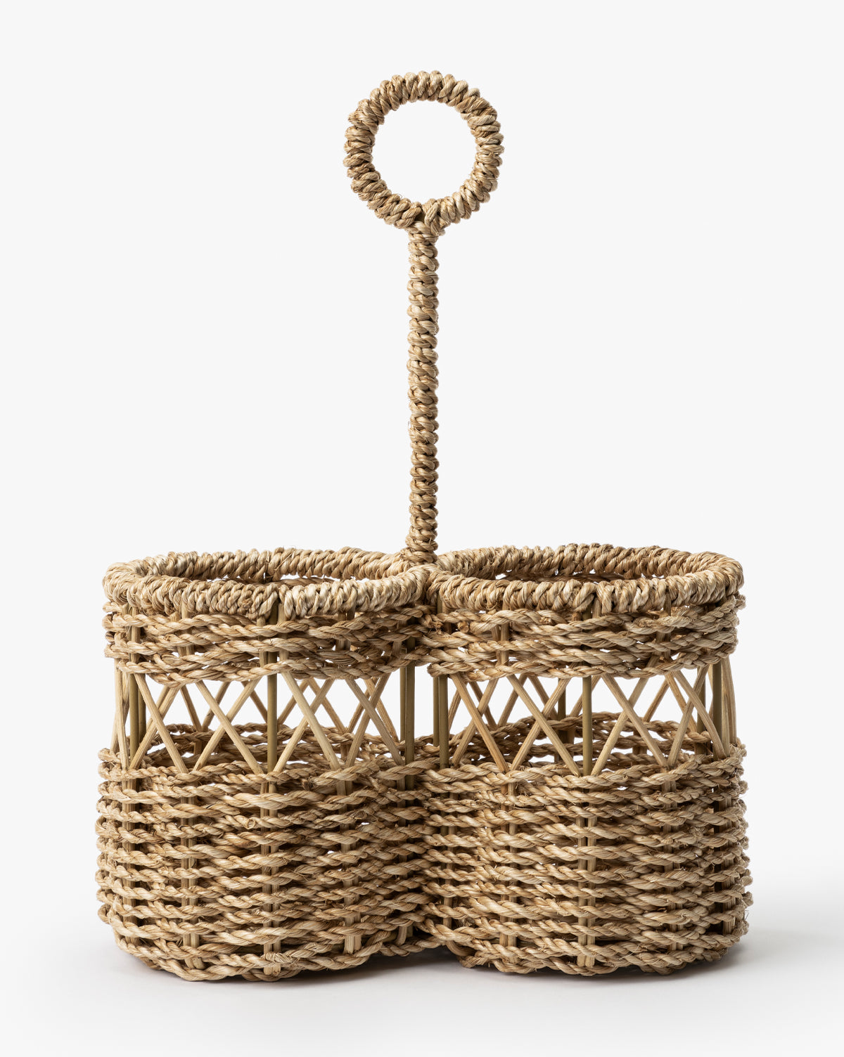 The Stokes Woven Caddy features two round compartments and a tall, looped handle, all crafted from natural abaca wicker—perfect for adding stylish organization to your kitchen counter, by Vendixs