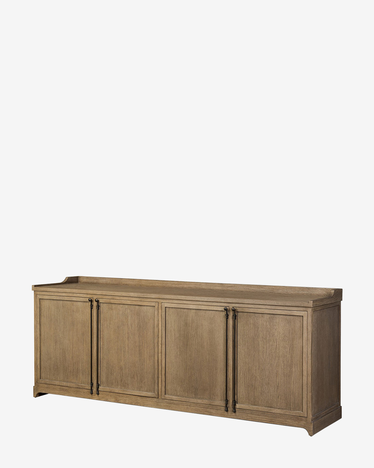 The Stonington Oak Sideboard is a long, rectangular piece with four panel doors, black metal handles, a weathered washed oak finish, and a raised back edge for a vintage-inspired look, by Vendixs