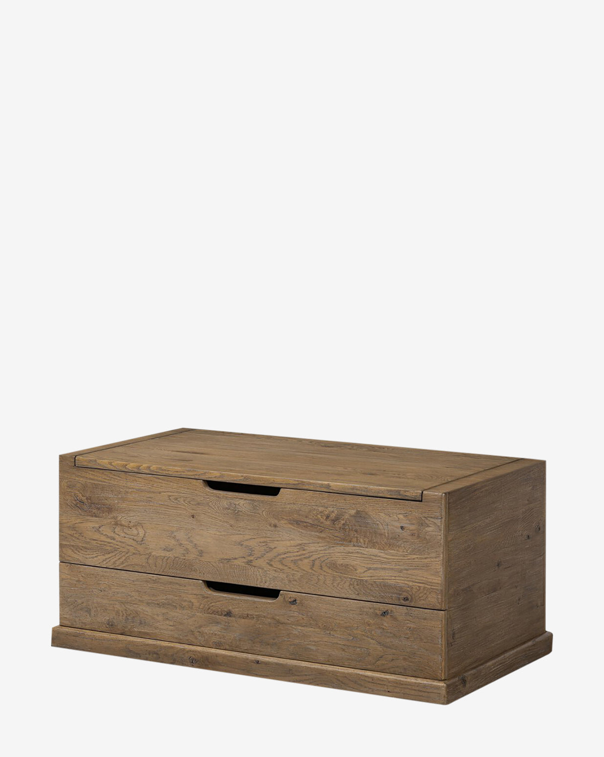 The Sutton Trunk is a rectangular storage chest with a hinged lid, two pull-out drawers, and a weathered oak finish highlighting its natural wood grain and minimalist design, by Vendixs