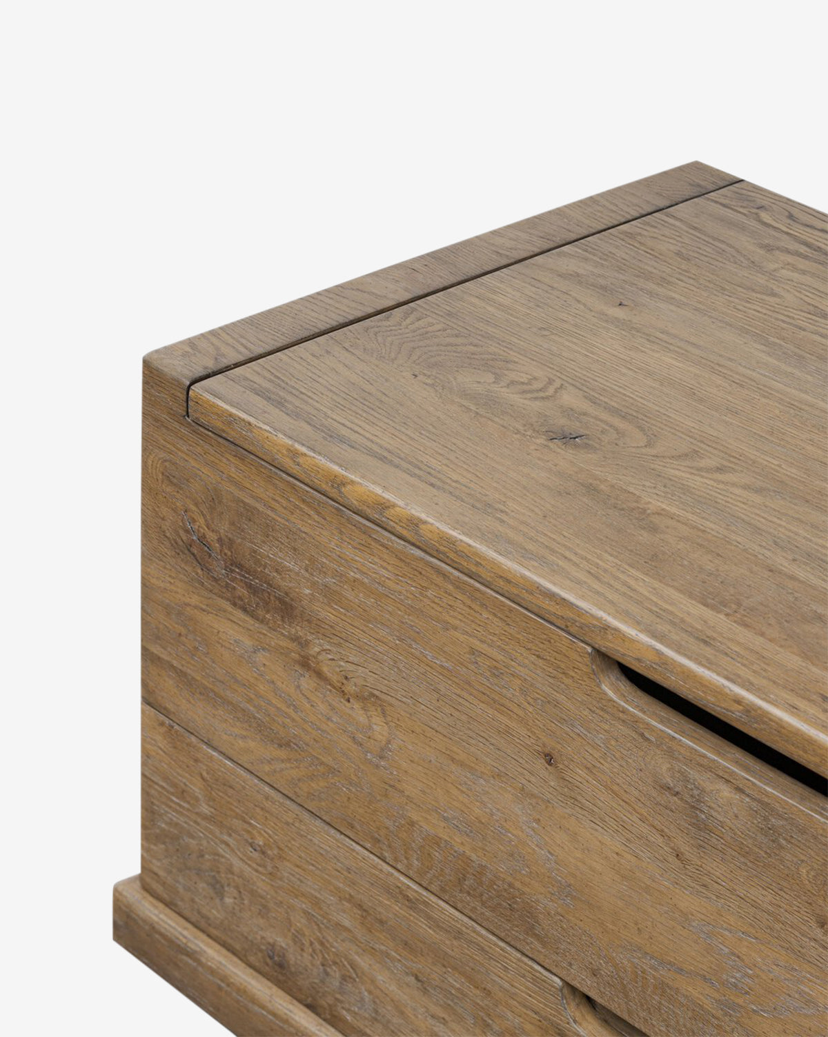 A close-up of the Sutton Trunk highlights its weathered oak finish, clean lines, and modern design with functional storage drawers, by Vendixs