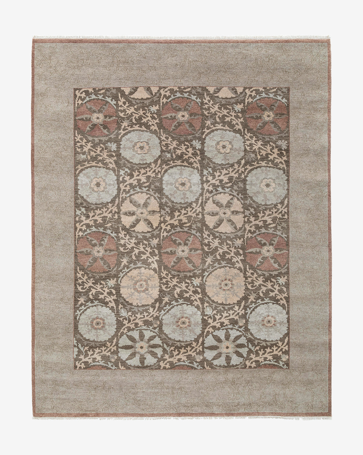 The Suzani Hand-Knotted Wool Rug is a rectangular handmade piece with a muted brown border and a grid of circular floral motifs in soft blue, beige, and rust on a dark background by Vendixs