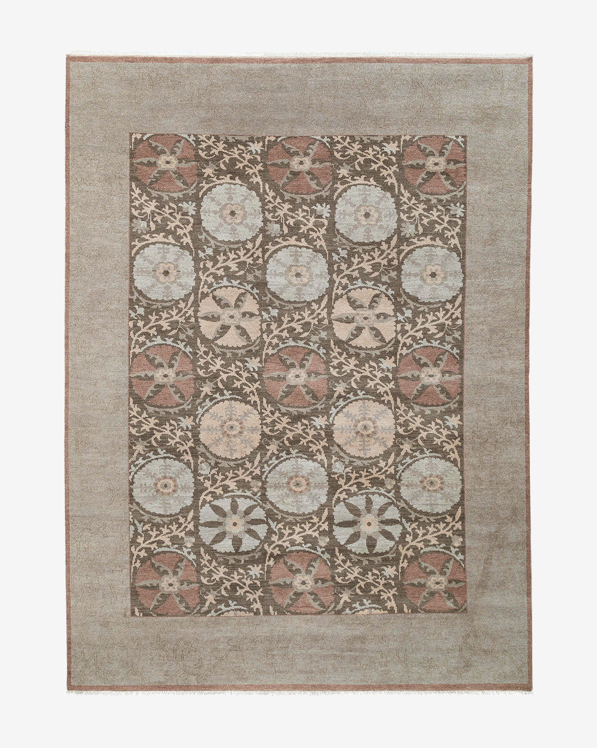 The Suzani Hand-Knotted Wool Rug is rectangular and features a muted border with repeating floral and geometric medallions in earthy brown, beige, blue, and cream tones, by Vendixs