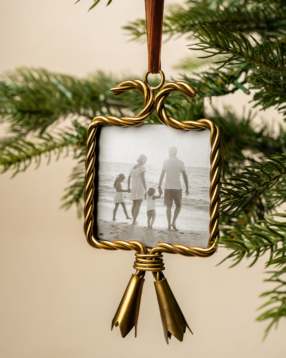 Embellished with two gold tassels, this elegant ornament is a cherished holiday keepsake, by Vendixs