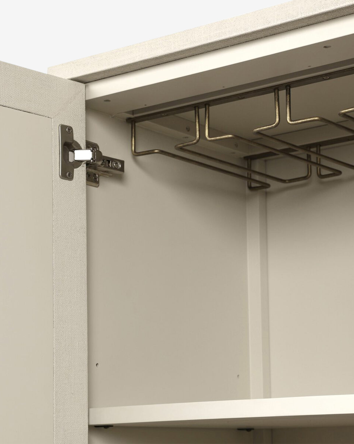 The Thaddeus Cabinet features a modern classic design with an open cabinet, metal hinges, an empty shelf, and an overhead metal rack for added storage in the light-toned upper section, by Vendixs