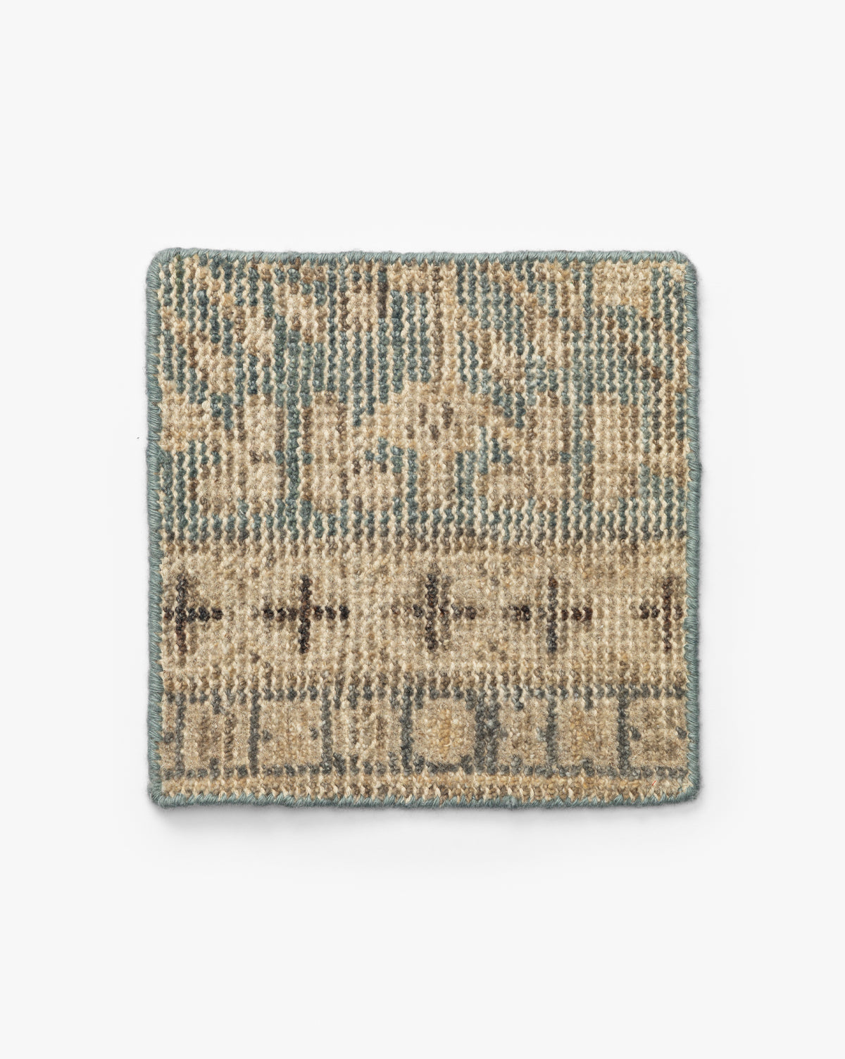The Thames Hand-Knotted Rug Swatch is a small, rectangular sample featuring a beige, tan, and light blue geometric pattern with triangles, crosses, and a blue border—ideal for adding a touch of luxury or antique-inspired style to your home, by Vendixs