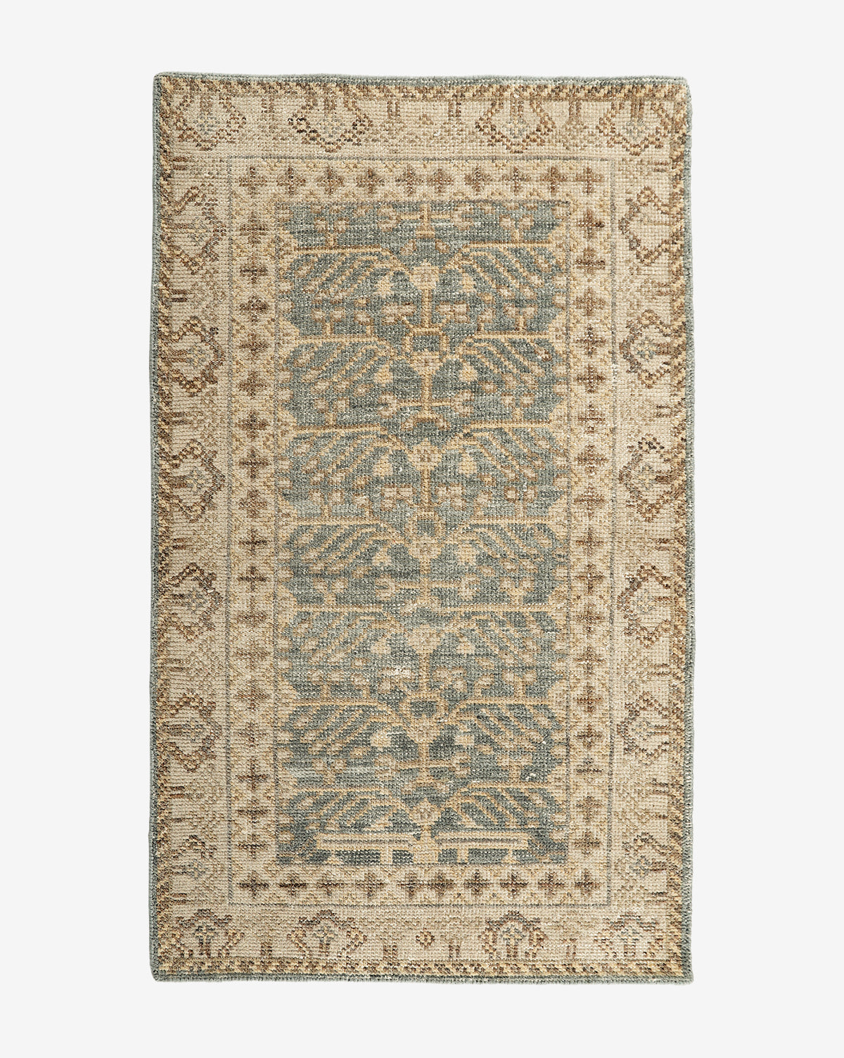 The Thames Hand-Knotted Rug features an ornate central motif and decorative border in muted blue, beige, and brown tones, adding vintage charm and elegance to any luxury home decor, by Vendixs