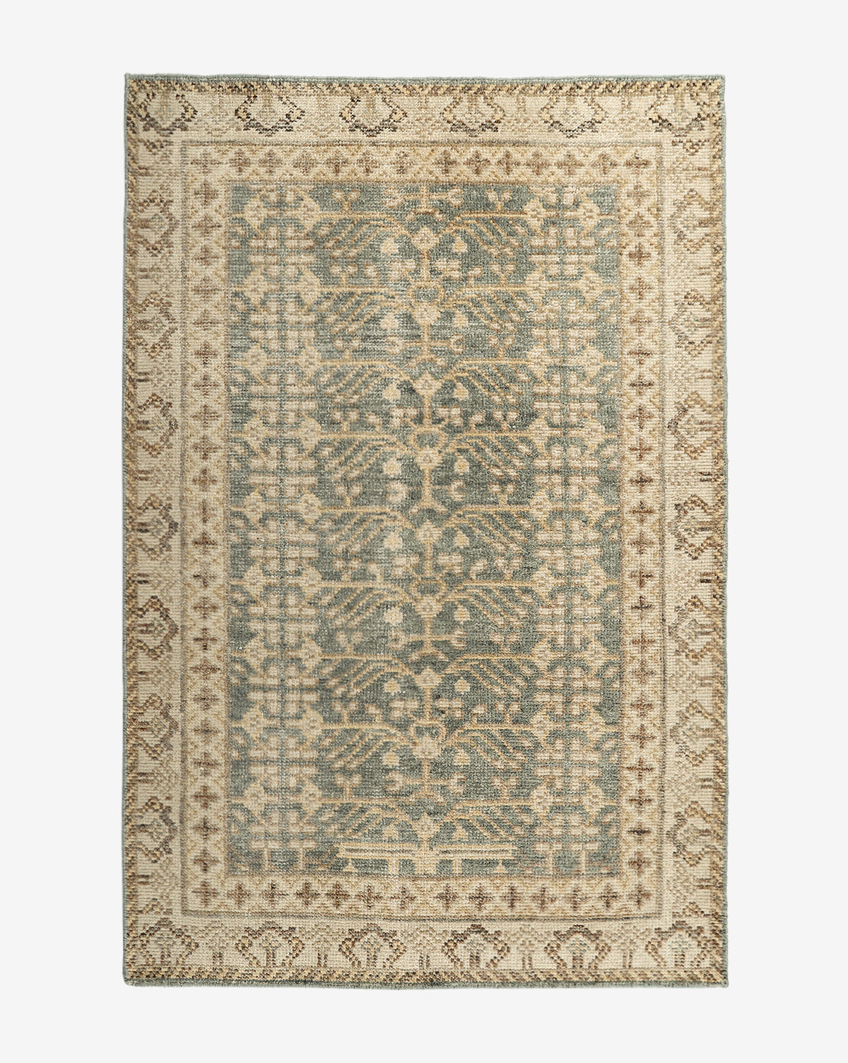 The Thames Hand-Knotted Rug features a rectangular, antique-inspired design with ornate floral and geometric patterns in muted blue, beige, and cream tones. Its decorative border and vintage style make it ideal for luxury home decor, by Vendixs