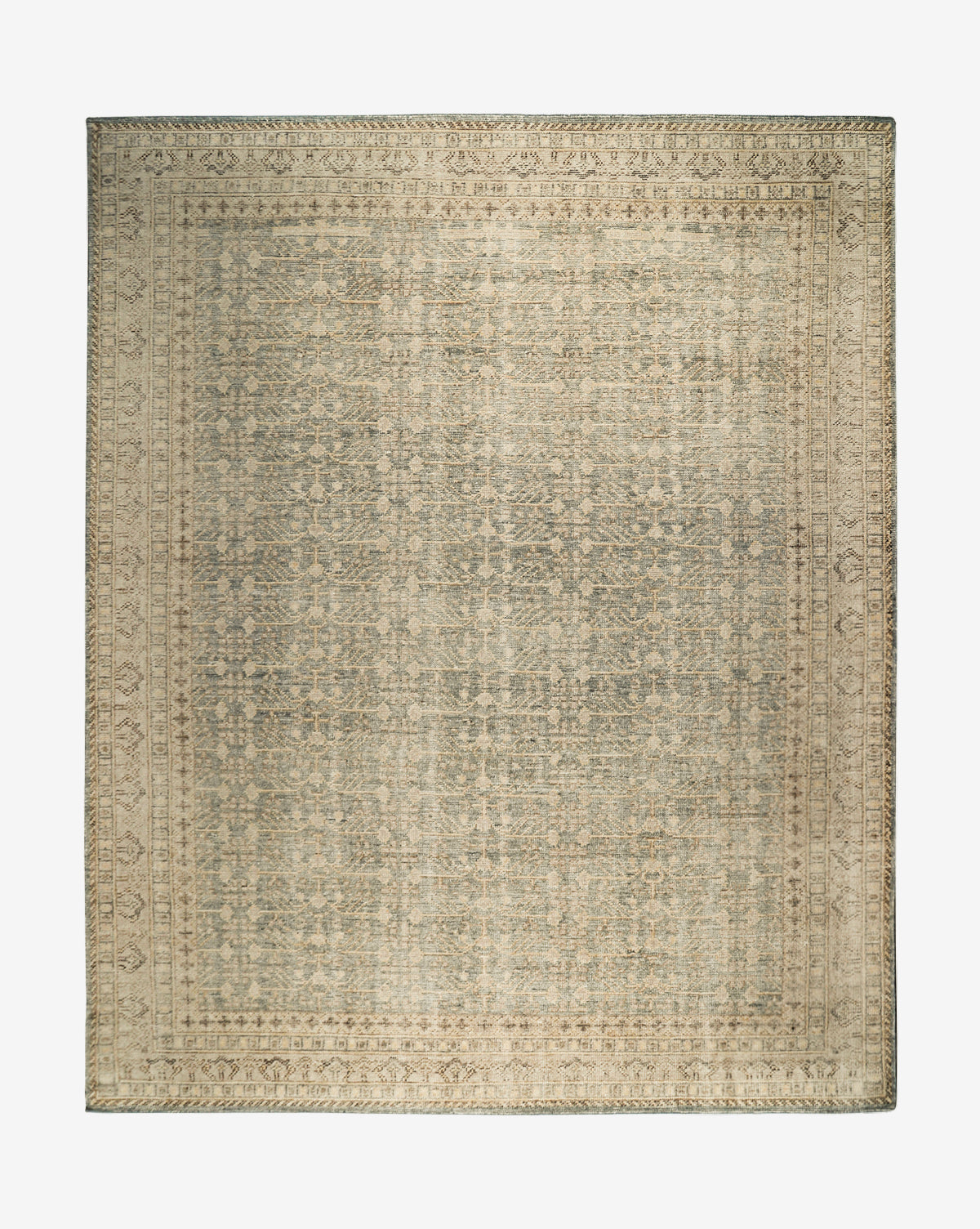 The Thames Hand-Knotted Rug features a rectangular, antique-inspired design with intricate faded patterns in beige, gray, and blue tones, a decorative border, and a vintage look—ideal for luxury home decor, by Vendixs