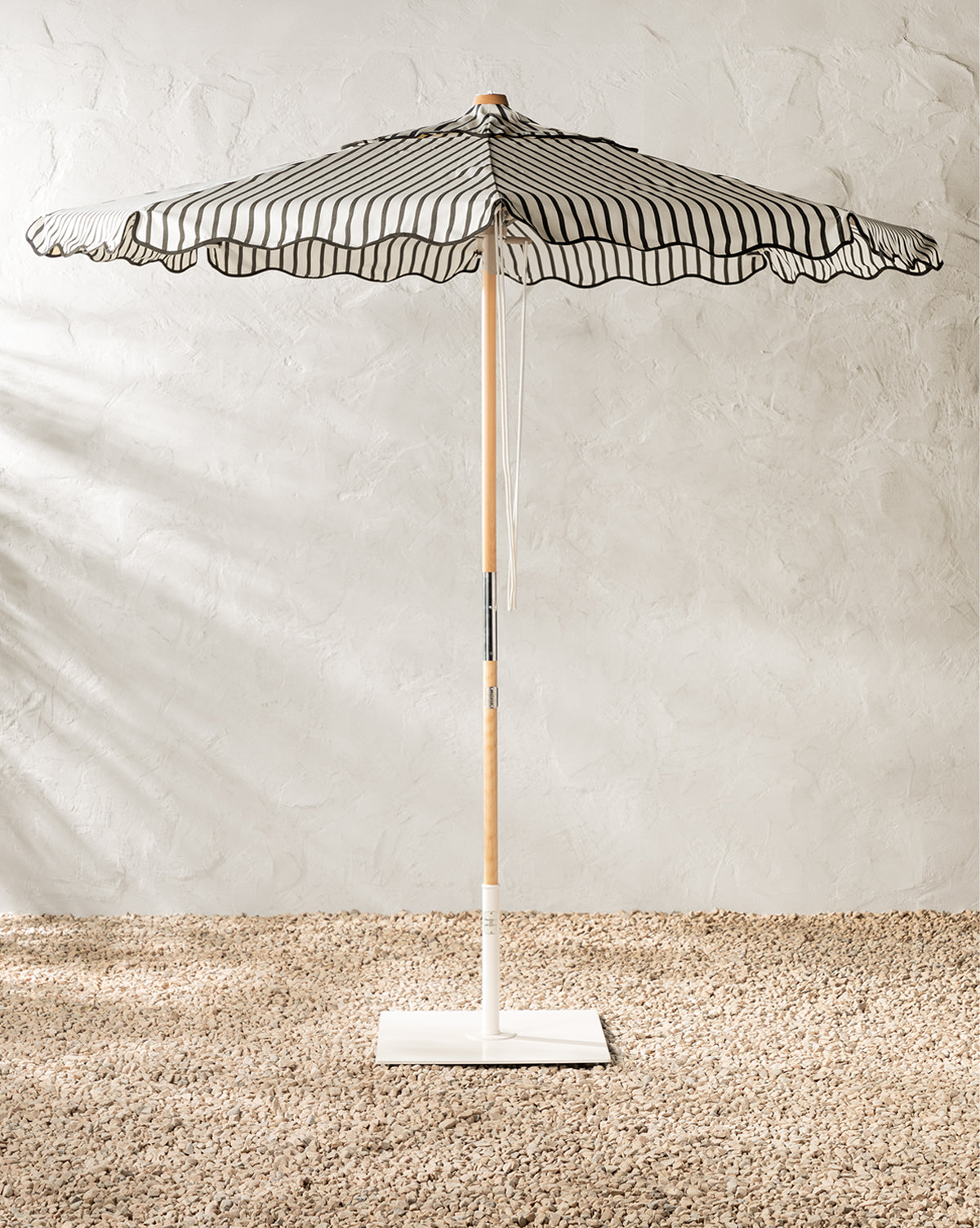The Market Umbrella in Monaco Black Stripe, can add a vintage feel our patio or poolside from Vendixs
