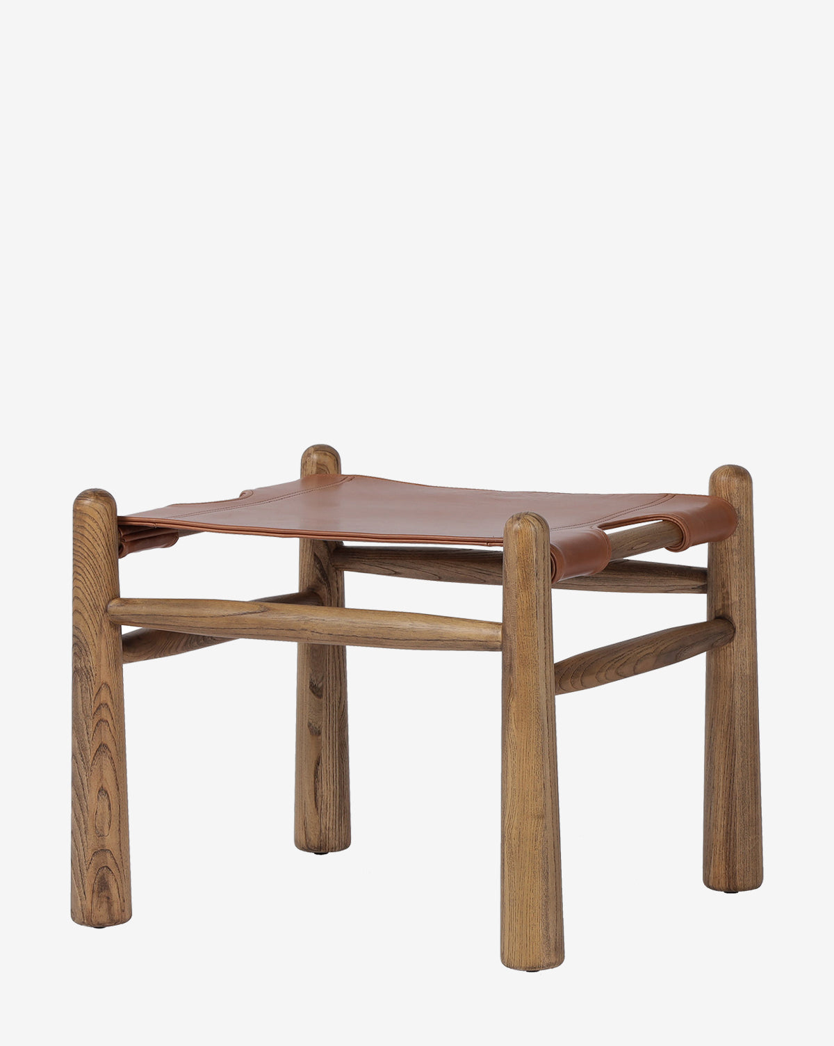 The Tierney Ottoman by Four Hands boasts a minimalist design with rounded solid wood legs and a seat of smooth, top-grain brown leather, offering modern simplicity and timeless elegance by Vendixs