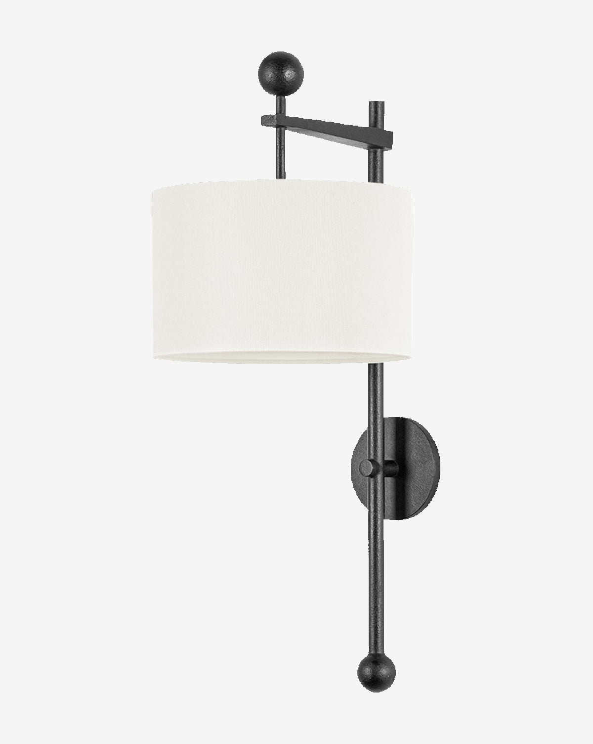 The Tisbury Sconce by Troy Lighting features a black forged iron frame with geometric accents and a cylindrical white fabric shade. Vertical and horizontal rods end in round finials, adding a sleek modern touch. Vendixs
