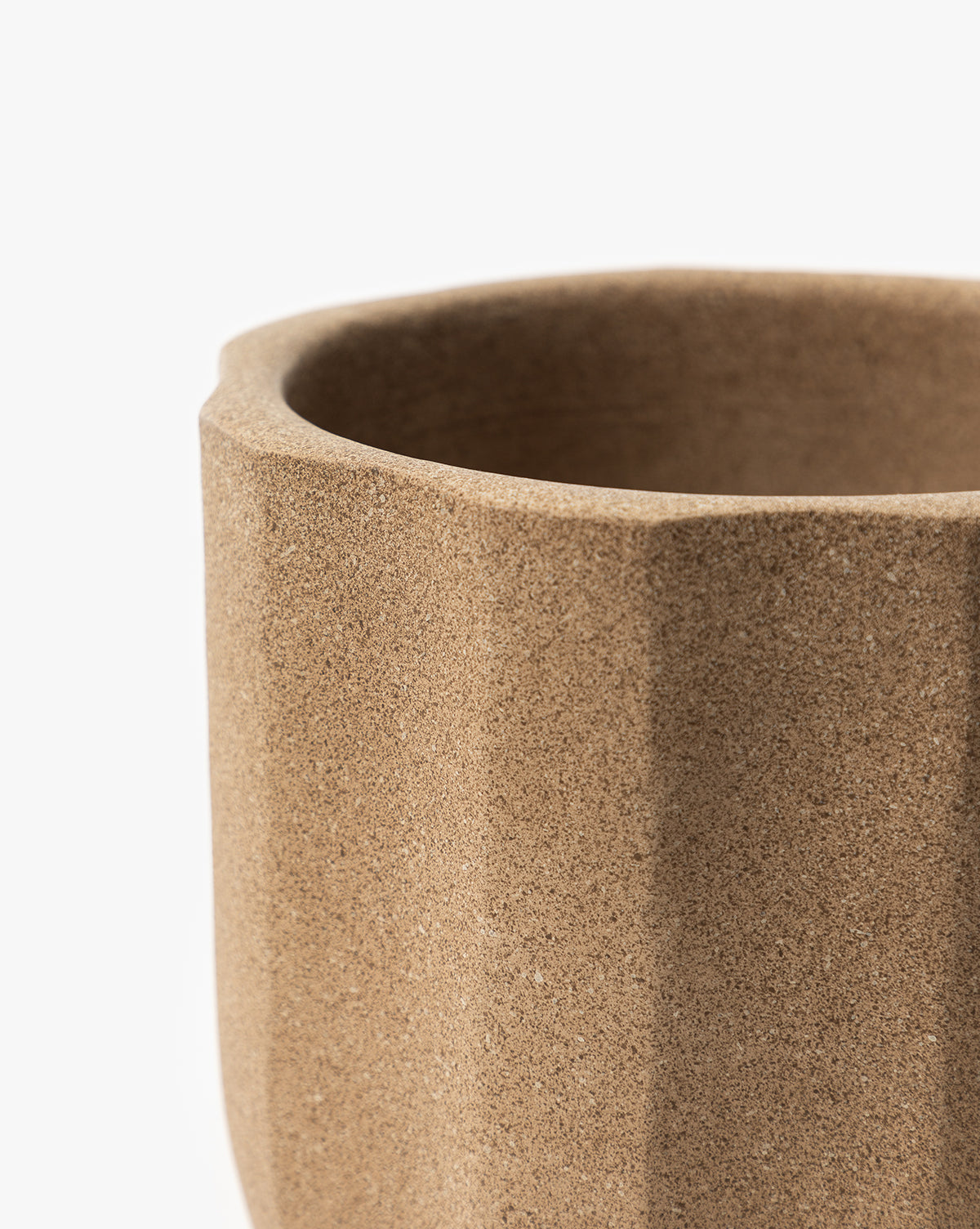 Close up of a small Trella Planter, approx. 6” Dia. x 7” H, in textured terracotta finish, from Vendixs