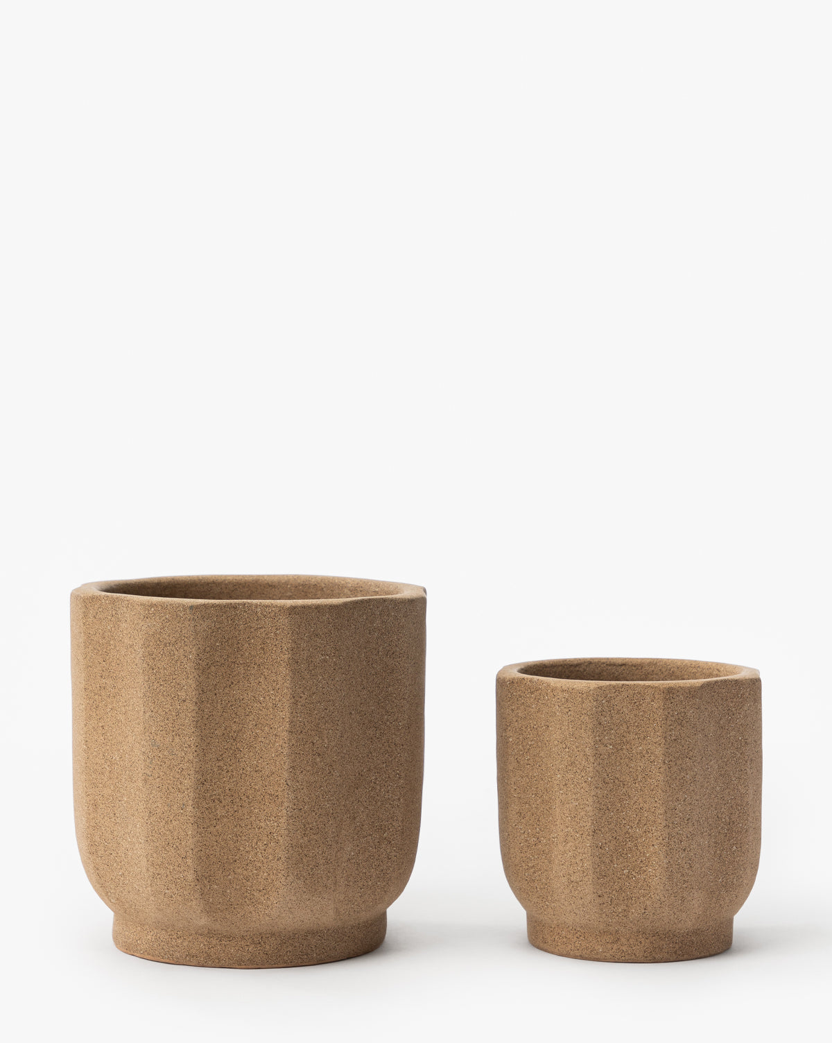 Small Trella Planter, approx. 6” Dia. x 7” H, and in 8” Dia. x 9” H, in textured terracotta finish, from Vendixs