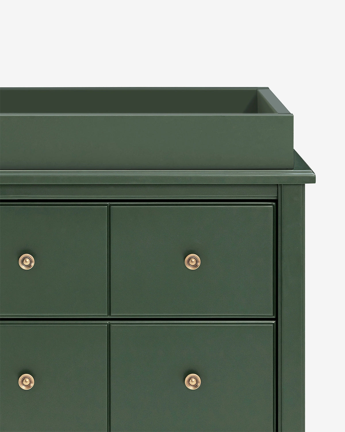 A close-up of the Universal Wide Removable Changing Tray in dark green with gold knobs, highlighting the top left corner and four drawers—ideal for organizing baby essentials against a plain white background, by Vendixs