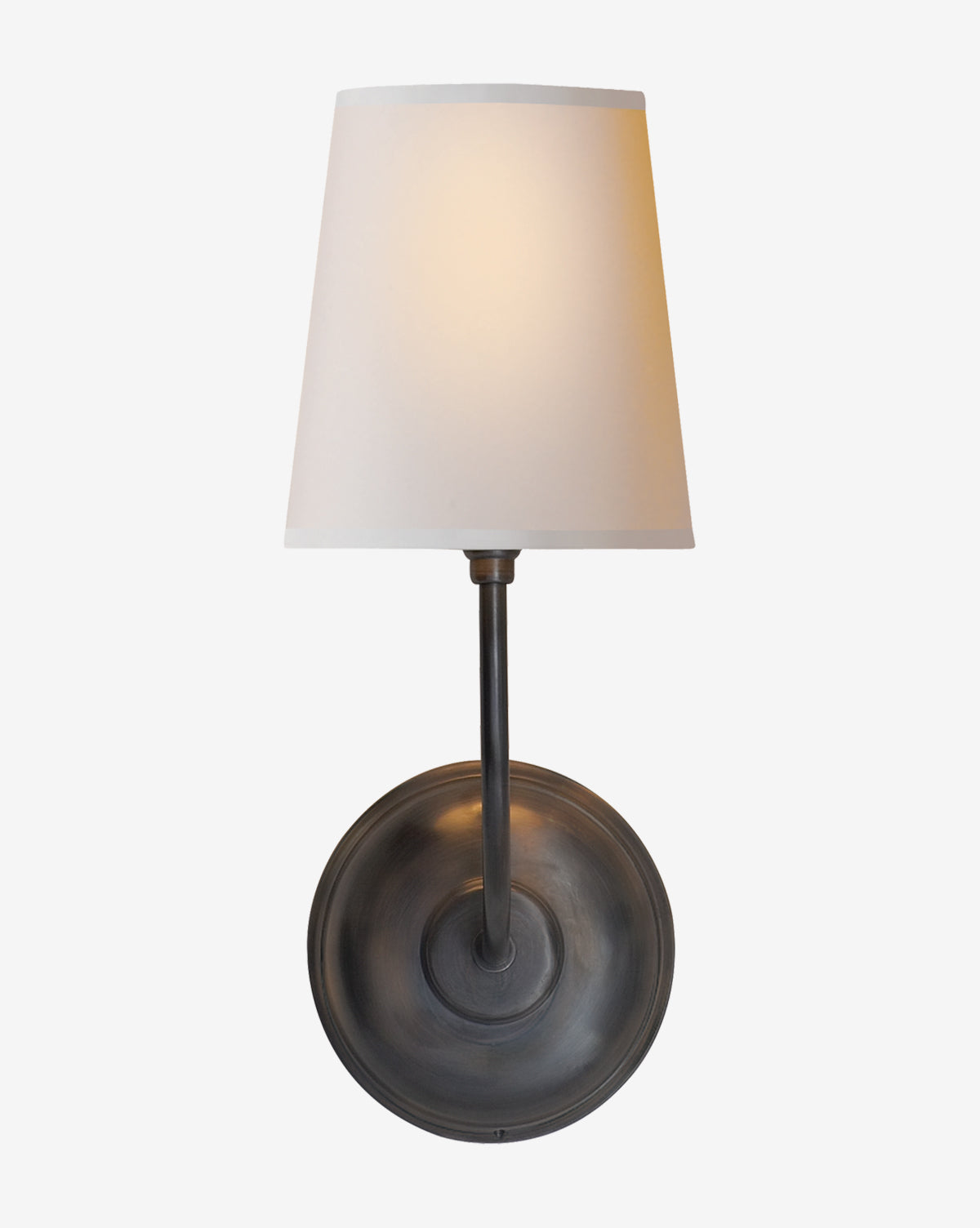 The Vendome Single Sconce by Visual Comfort & Co. Signature features a round dark metal base, straight vertical arm, and white linen shade—illuminated softly and ideal for use with a candelabra bulb. Available at Vendixs