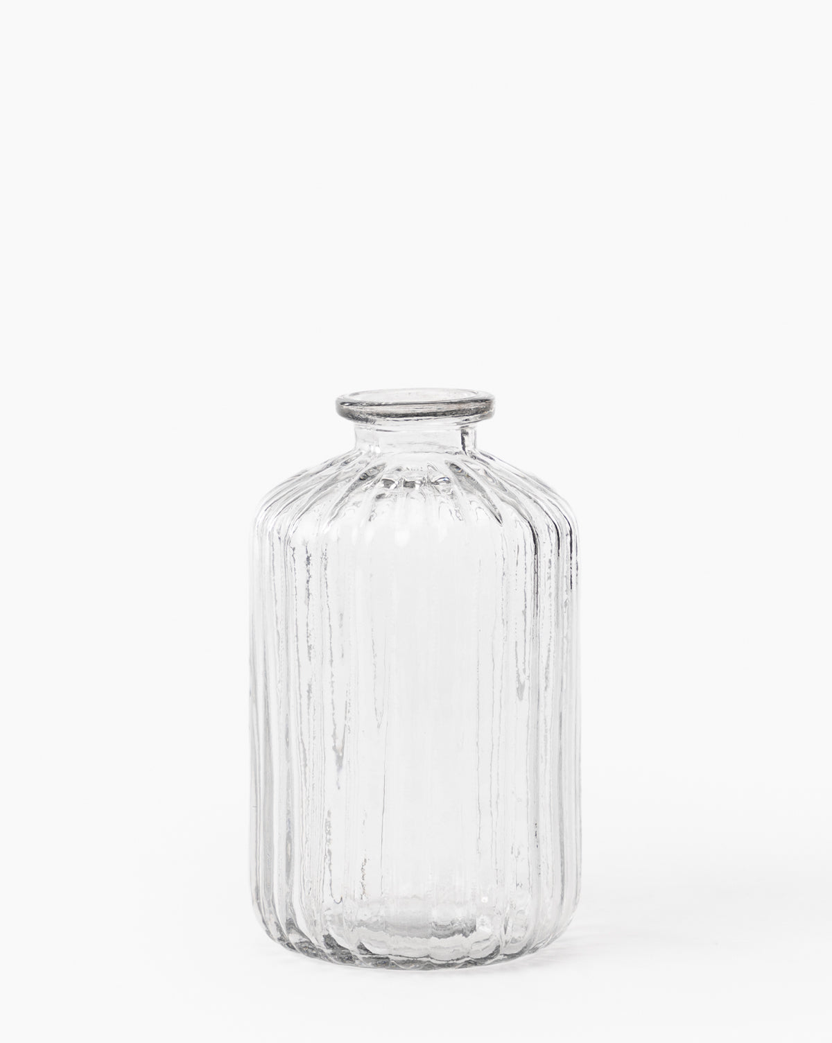 The Verlice Glass Cylinder Vase is mouth-blown with vertical textured ribbed lines, featuring a cylindrical shape and a short, narrow neck, set against a plain white background.