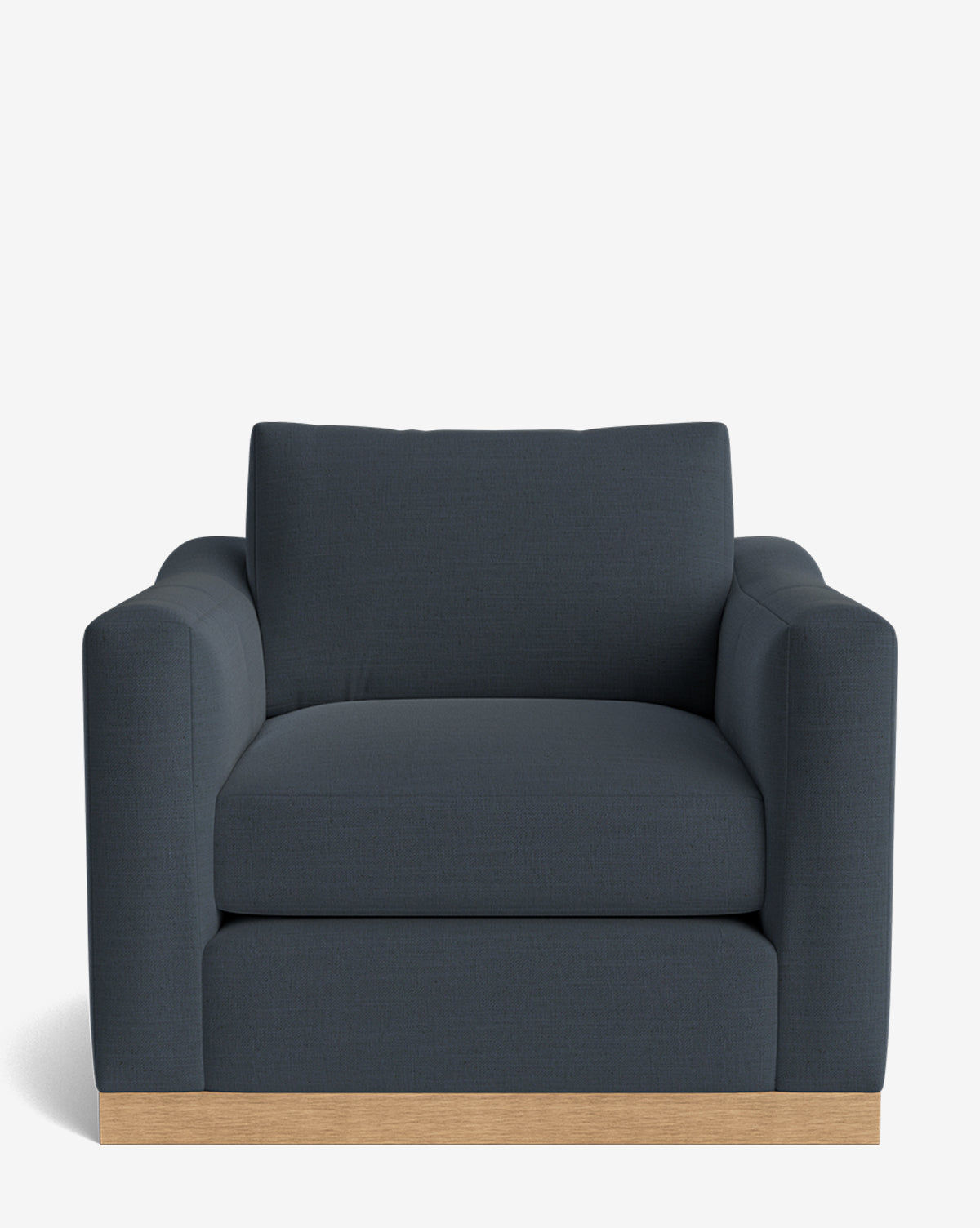 The Vernon Lounge Chair features a modern design in dark gray with plush cushions, wide armrests, a light alder wood frame, and customizable upholstery,. The accent chair shown against a plain white background by McGee & Co.