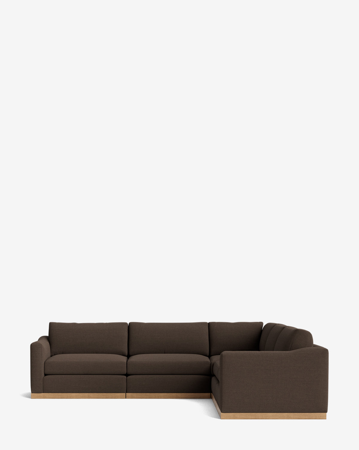 The Vernon Modular L Sectional 117.5 is a dark brown, L-shaped sofa with plush cushions and a wooden base, displayed against a plain white background by McGee & Co.