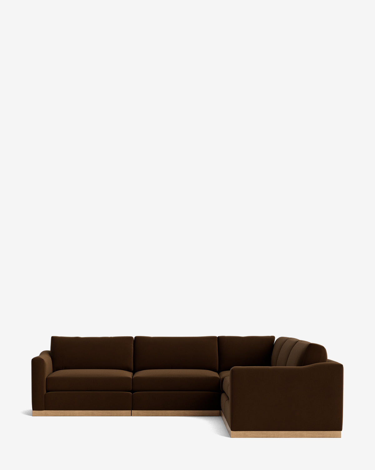 The Vernon Modular L Sectional 117.5 features a modern dark brown design with plush cushions and a low wooden base, offering customizable style and flexibility, shown against a plain white background by McGee & Co.