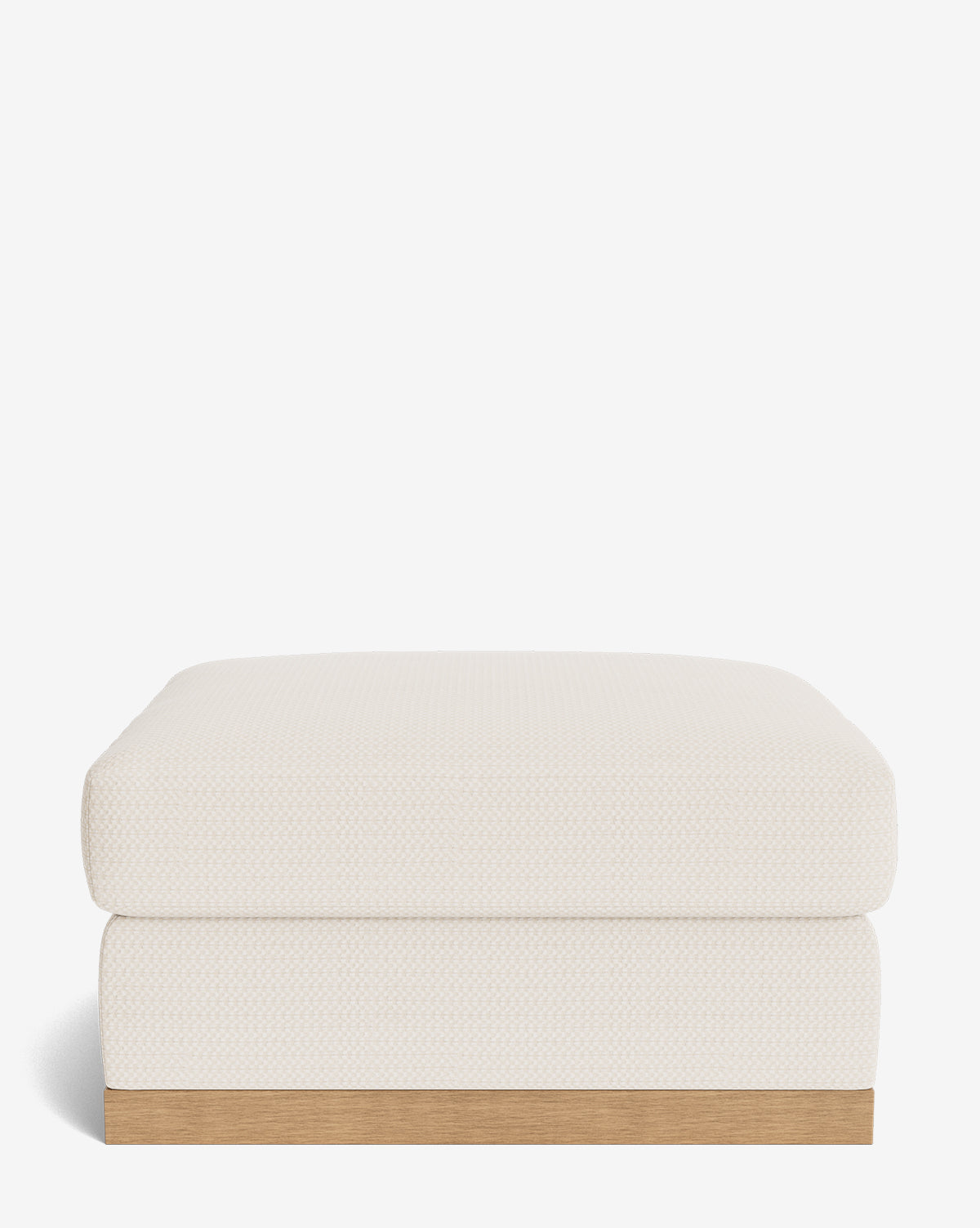 The Vernon Modular Ottoman features a modern rectangular design, cream-colored textured fabric, and a light wood base, shown against a plain white background by McGee & Co.