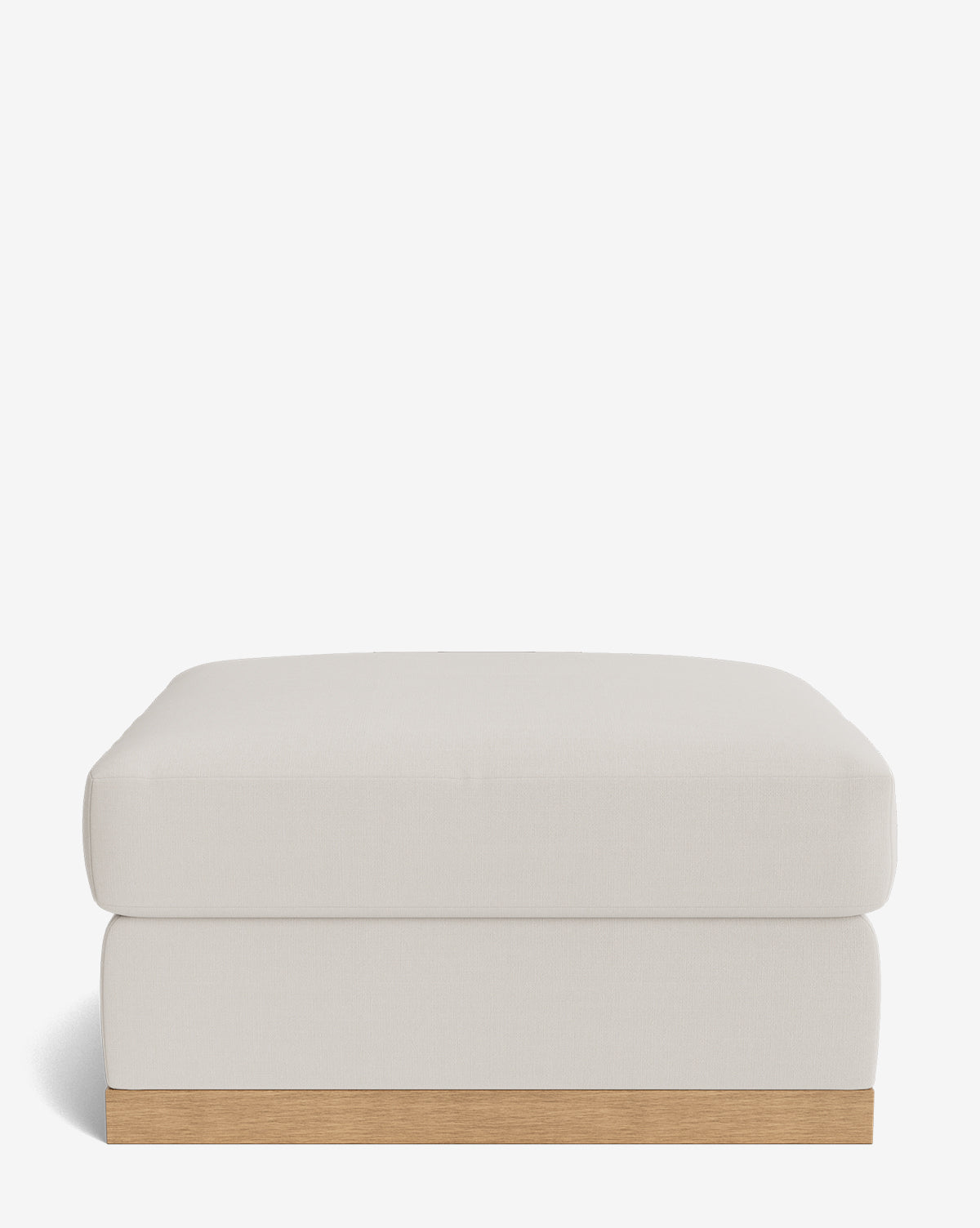 The Vernon Modular Ottoman features a modern rectangular design with light beige velvet upholstery and a simple wooden base, shown against a plain white background by Vendixs
