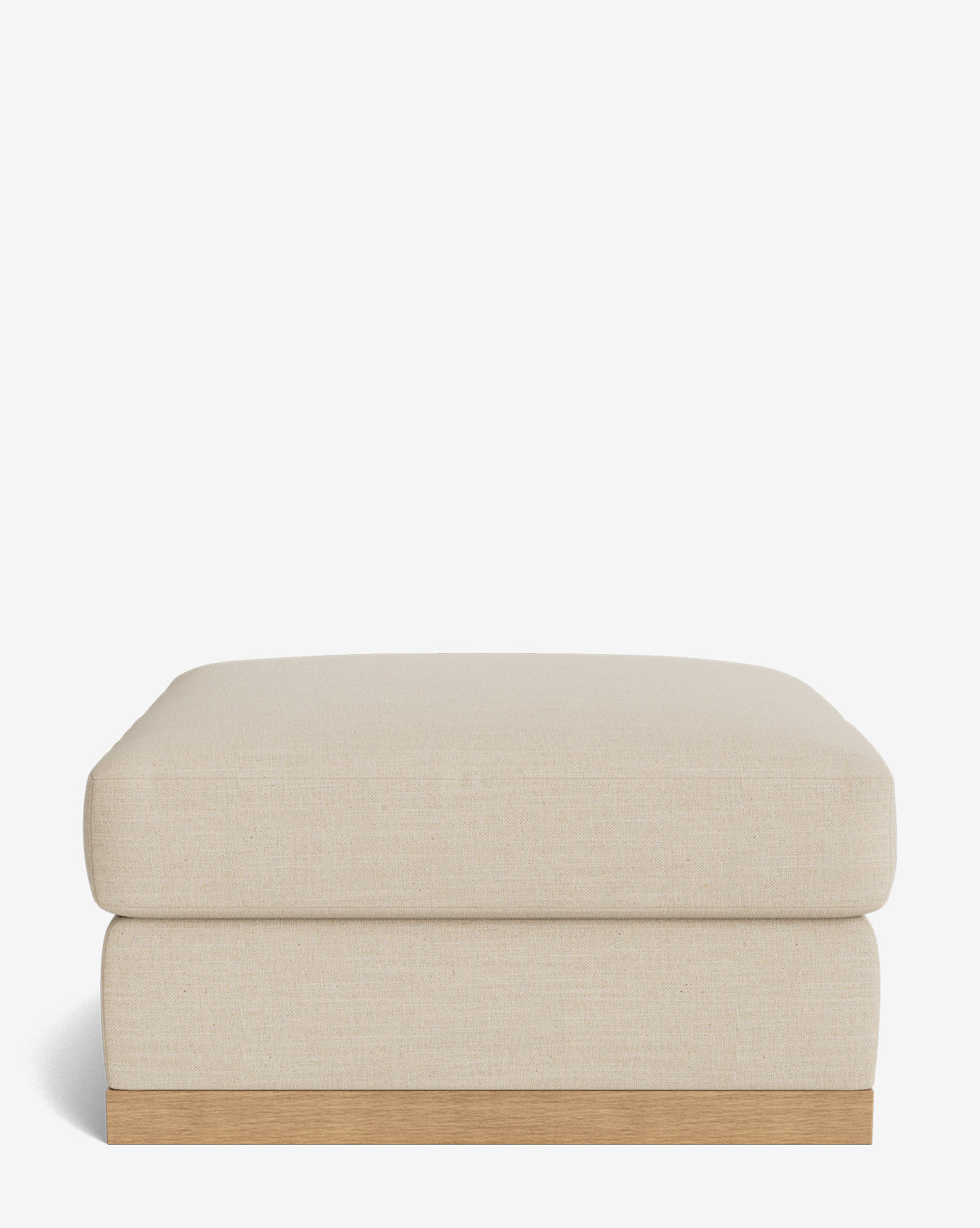 The Vernon Modular Ottoman is a modern, rectangular beige piece featuring a cushioned top and light wooden base, displayed against a plain white background by McGee & Co.
