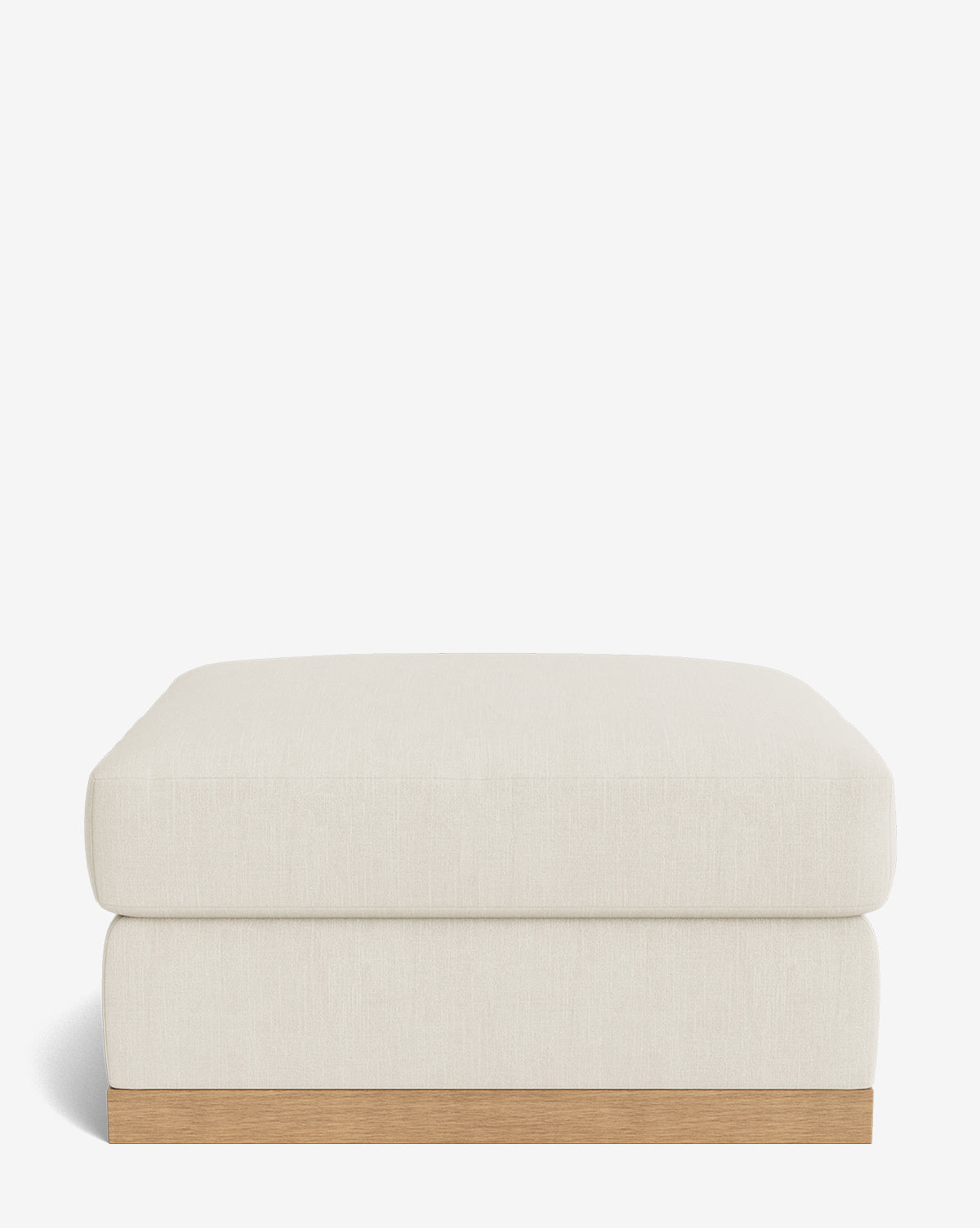 The Vernon Modular Ottoman features a simple rectangular design with a light beige upholstered cushion and a wooden base, showcased against a plain white background, by Vendixs