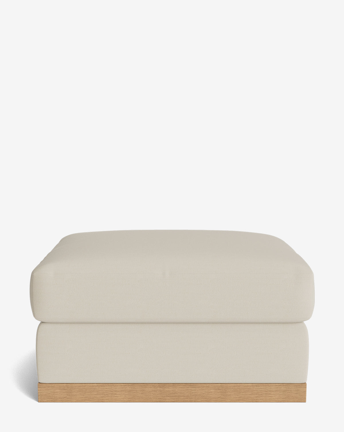 The Vernon Modular Ottoman is a rectangular, beige piece featuring a cushioned top and a light wooden base, displayed against a plain white background by McGee & Co.