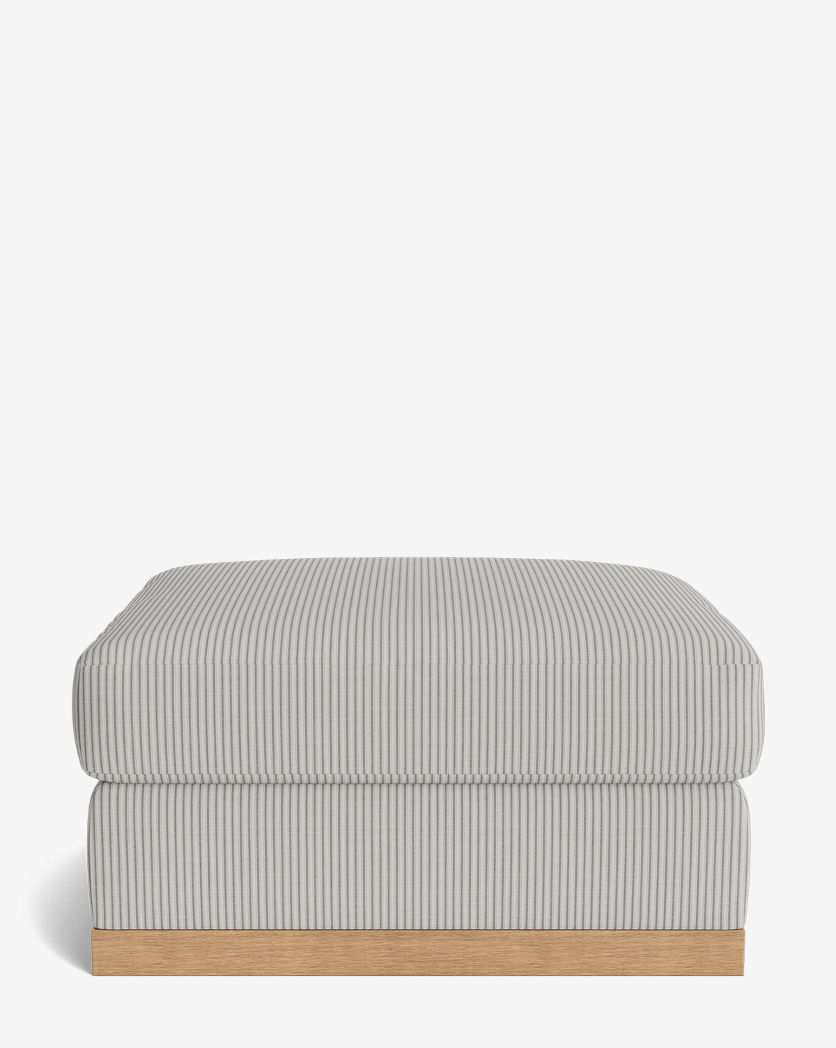 The Vernon Modular Ottoman features light gray and white vertical pinstripes, a plush cushioned top, and a light wooden base, shown against a plain white background by McGee & Co.
