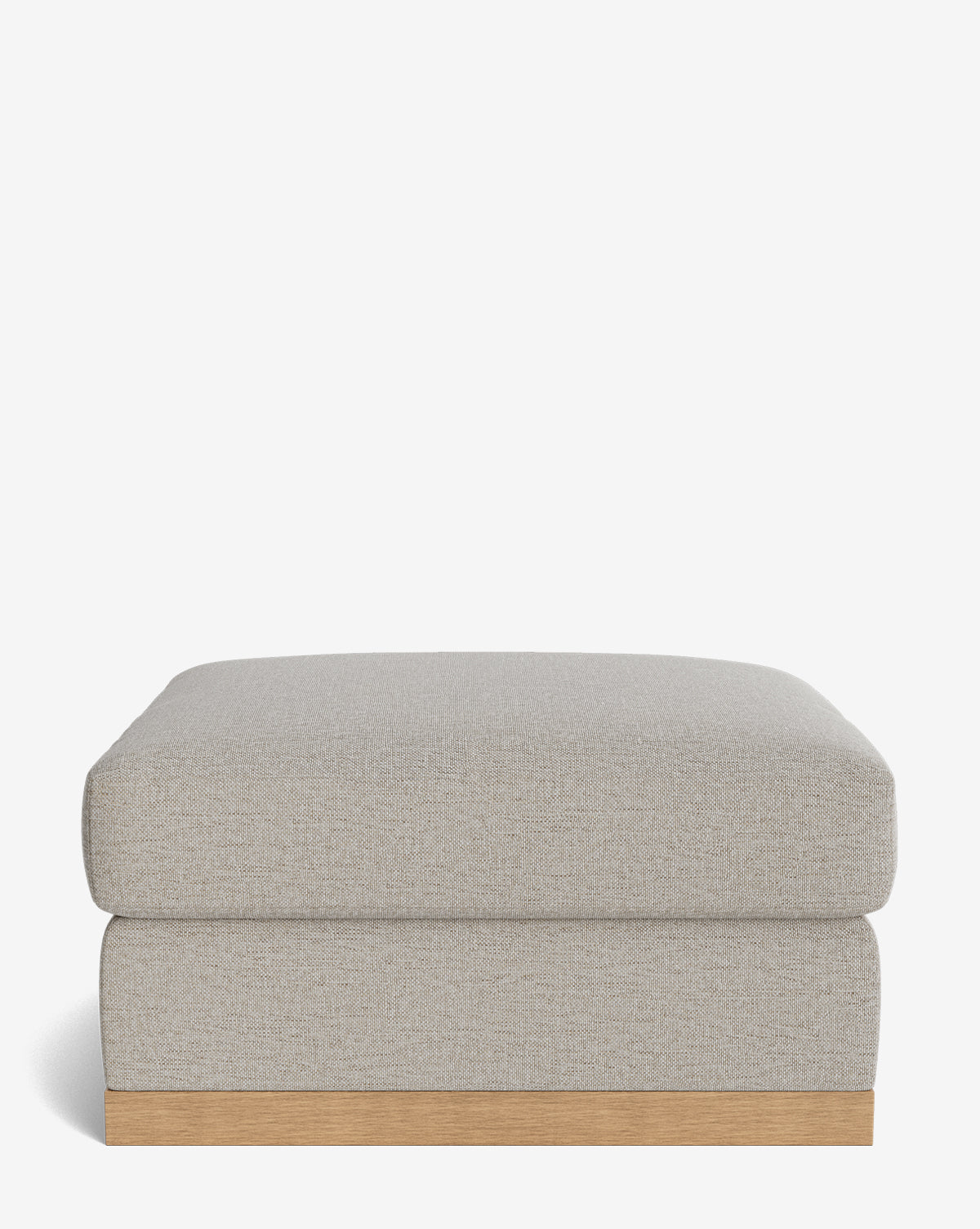 The Vernon Modular Ottoman features a modern rectangular design with light gray upholstery and a wooden base, displayed against a plain white background, by McGee & Co.
