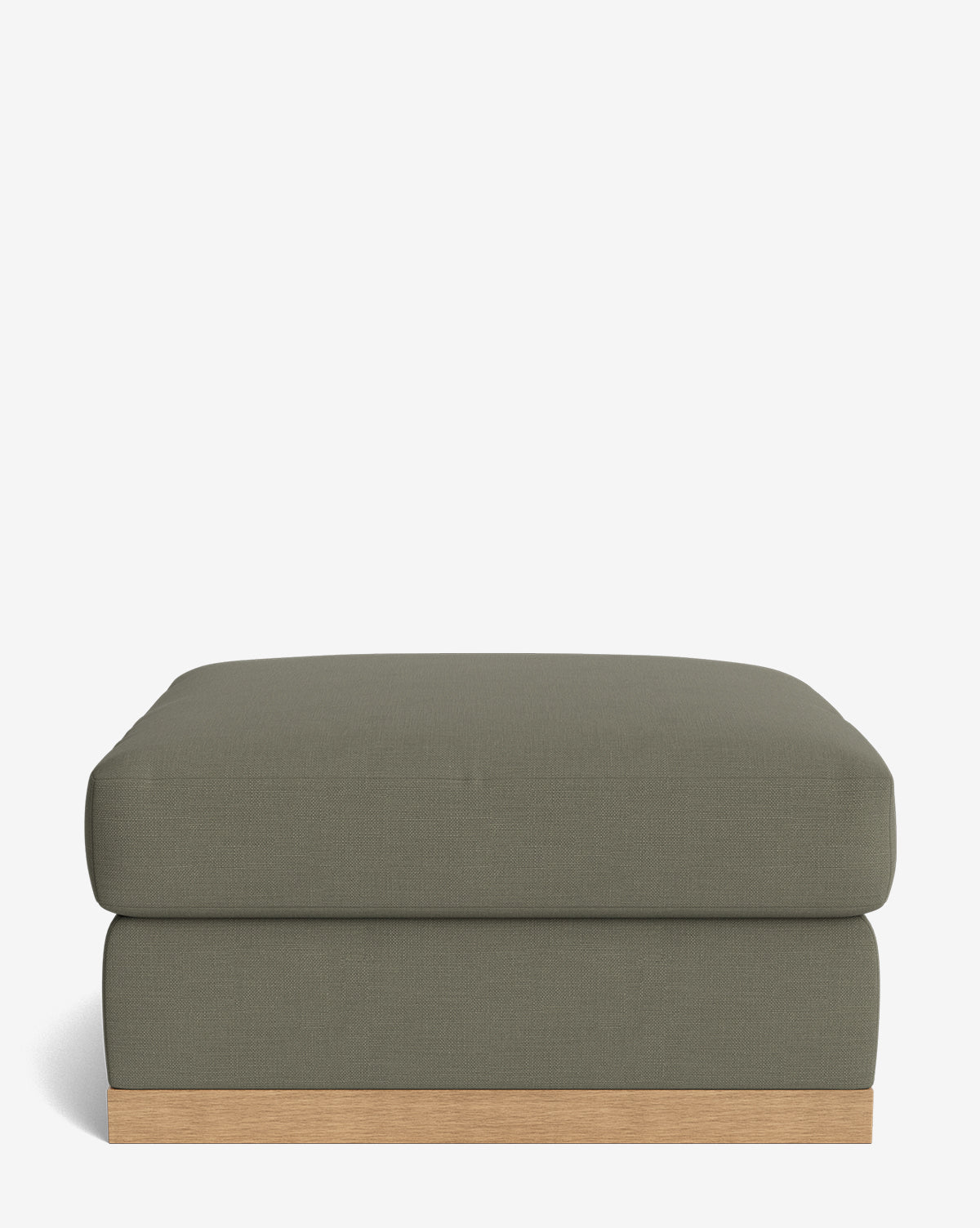 The Vernon Modular Ottoman features a low, rectangular design with olive green velvet upholstery and a light wooden base, displayed against a plain white background, by McGee & Co.