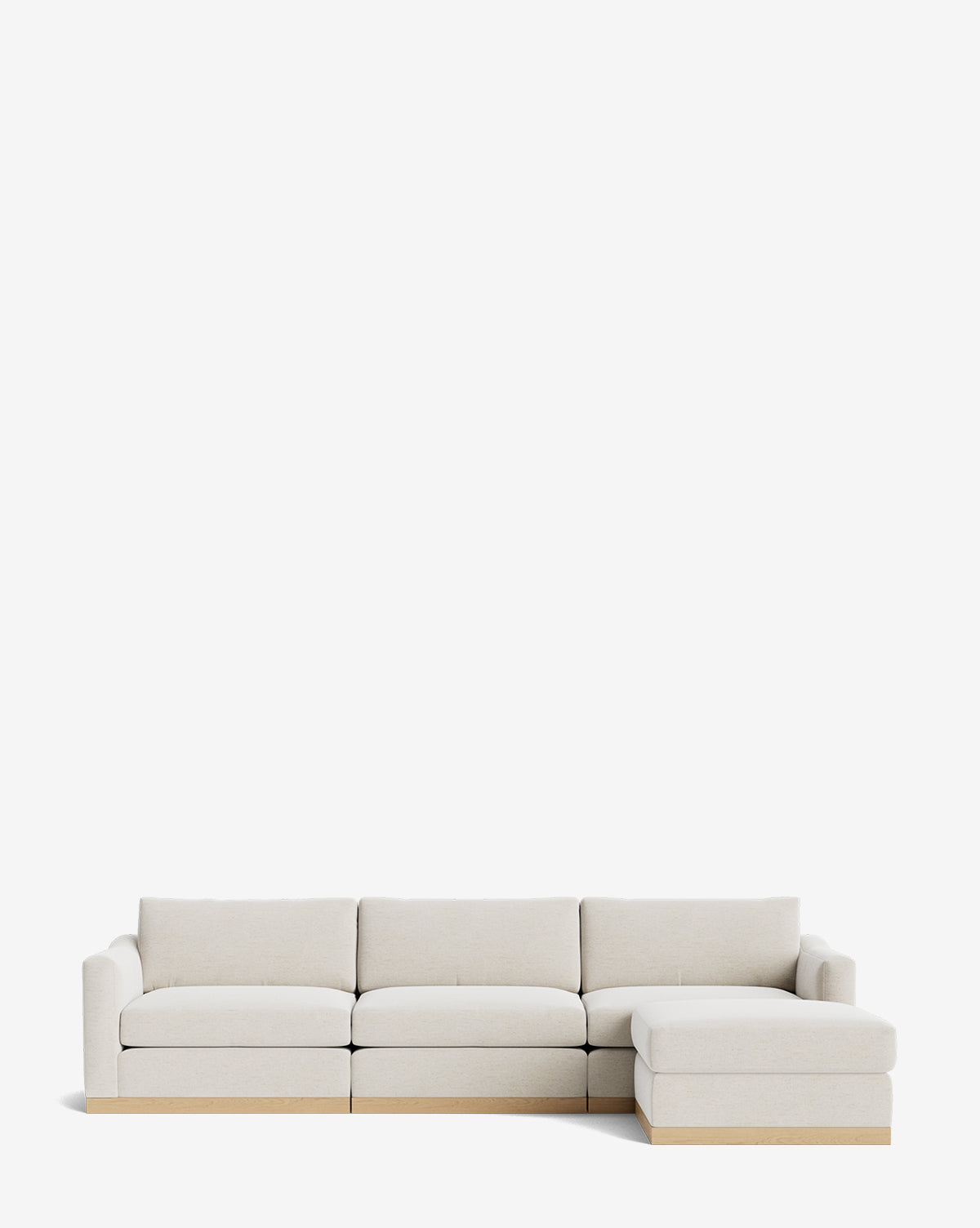 The Vernon Modular Sofa with Ottoman 121 is a modern, light beige fabric sofa with four seats, a right-side chaise lounge, minimalistic design, low wooden base, and plush cushions, shown against a plain white background by Vendixs