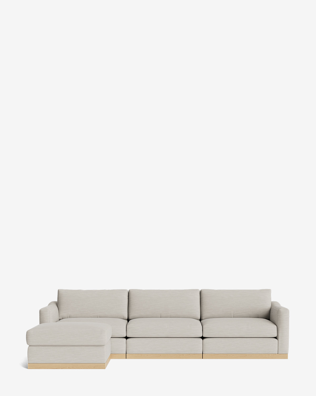The Vernon Modular Sofa with Ottoman 121 in light gray features four seat cushions, a left-side chaise lounge, and a low wooden base, by Vendixs This customizable fabric sofa blends comfort with contemporary style against a plain white background.