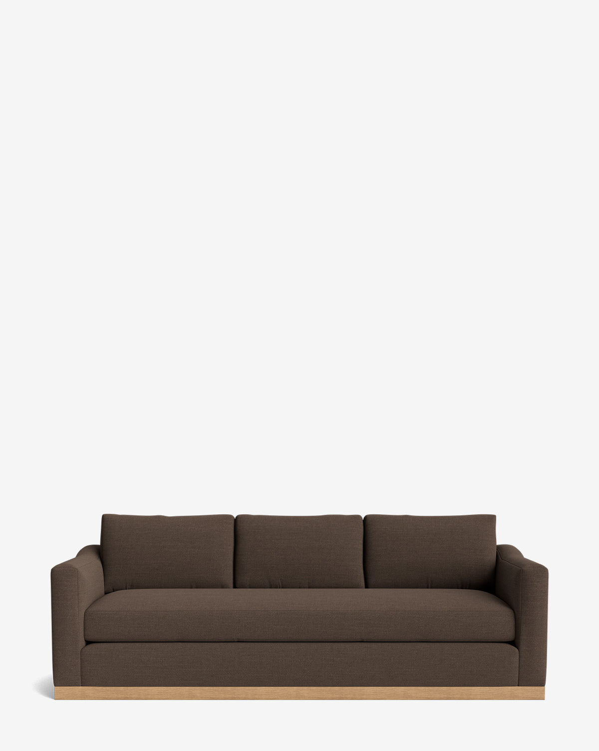 The Vernon Sofa 92 is a modern dark brown velvet three-seater with straight arms, three seat cushions, and a light alder wood frame base, shown against a plain white background by McGee & Co.