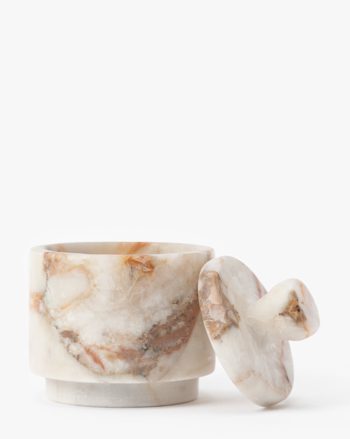 The Verona Matte Marble Lidded Jar showcases natural beige and brown veining, with its matching lid resting beside it on a white background—an elegant choice for stylish kitchen countertop decor, by Vendixs