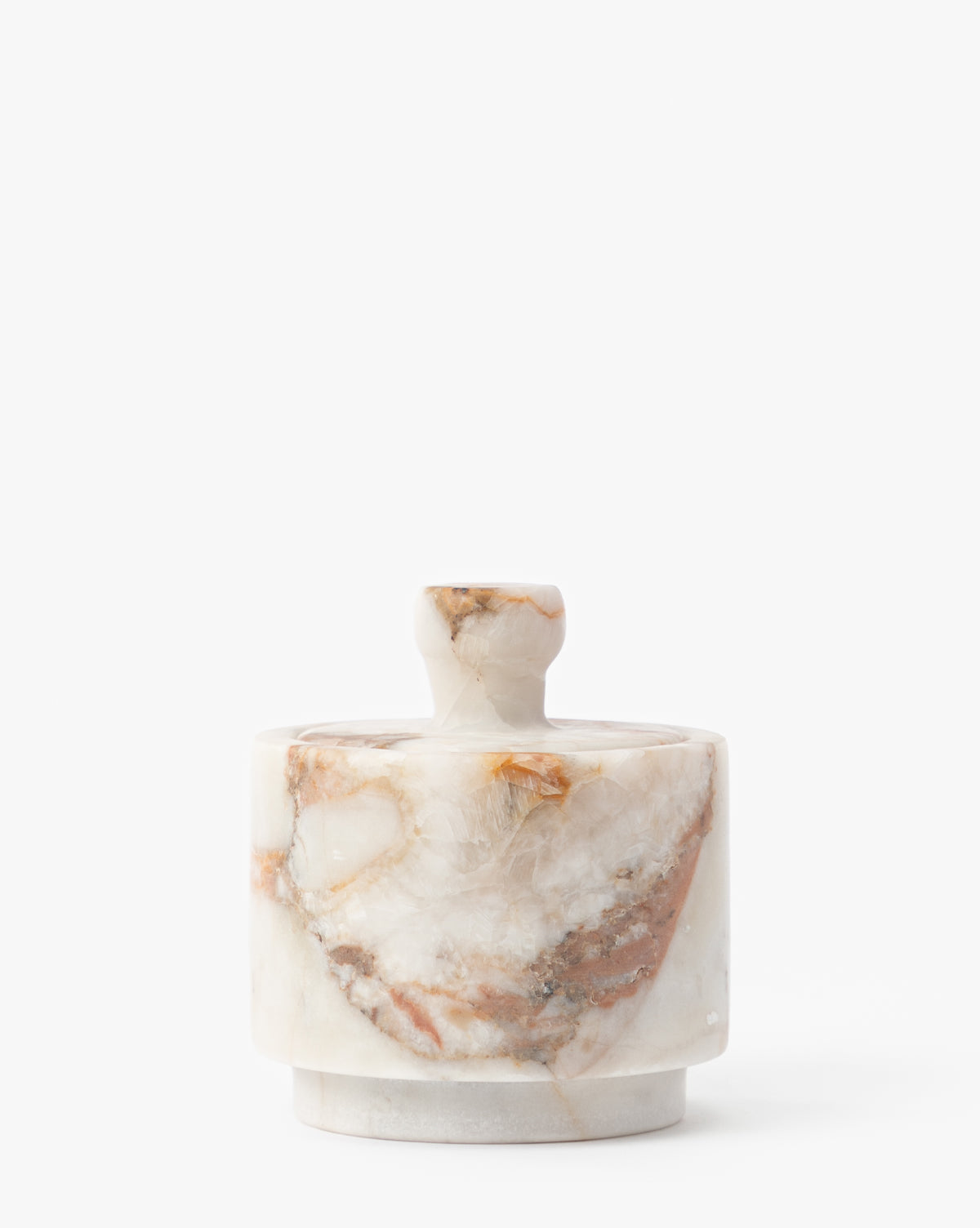 The Verona Matte Marble Lidded Jar features a round, white marble design with brown and tan veining, a matching lid with a small knob—ideal as decorative marble jar or kitchen countertop decor, by Vendixs