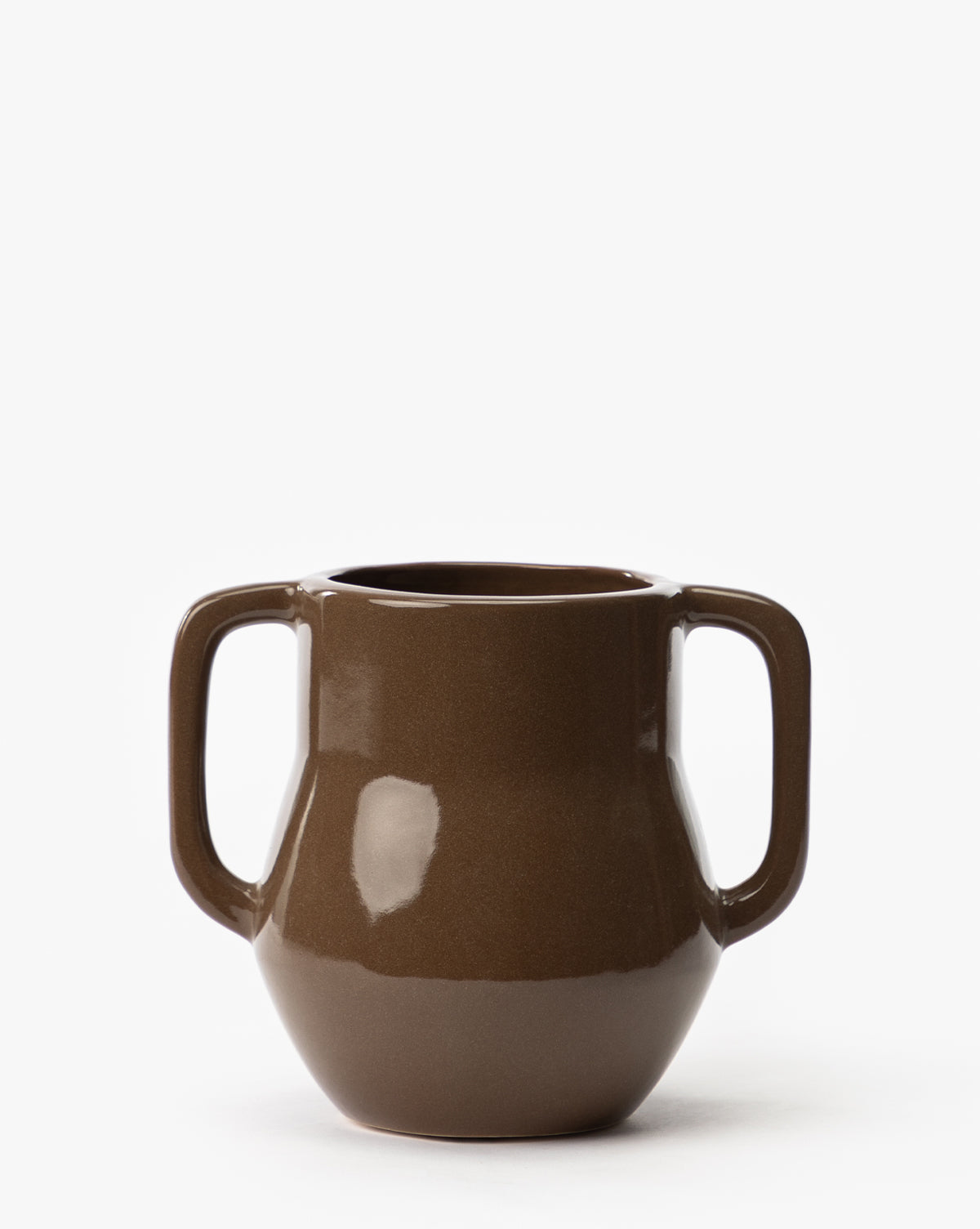 The Victoire Vase is a brown ceramic piece with a glossy finish, featuring two large handles on opposite sides, and is displayed against a plain white background, by Vendixs